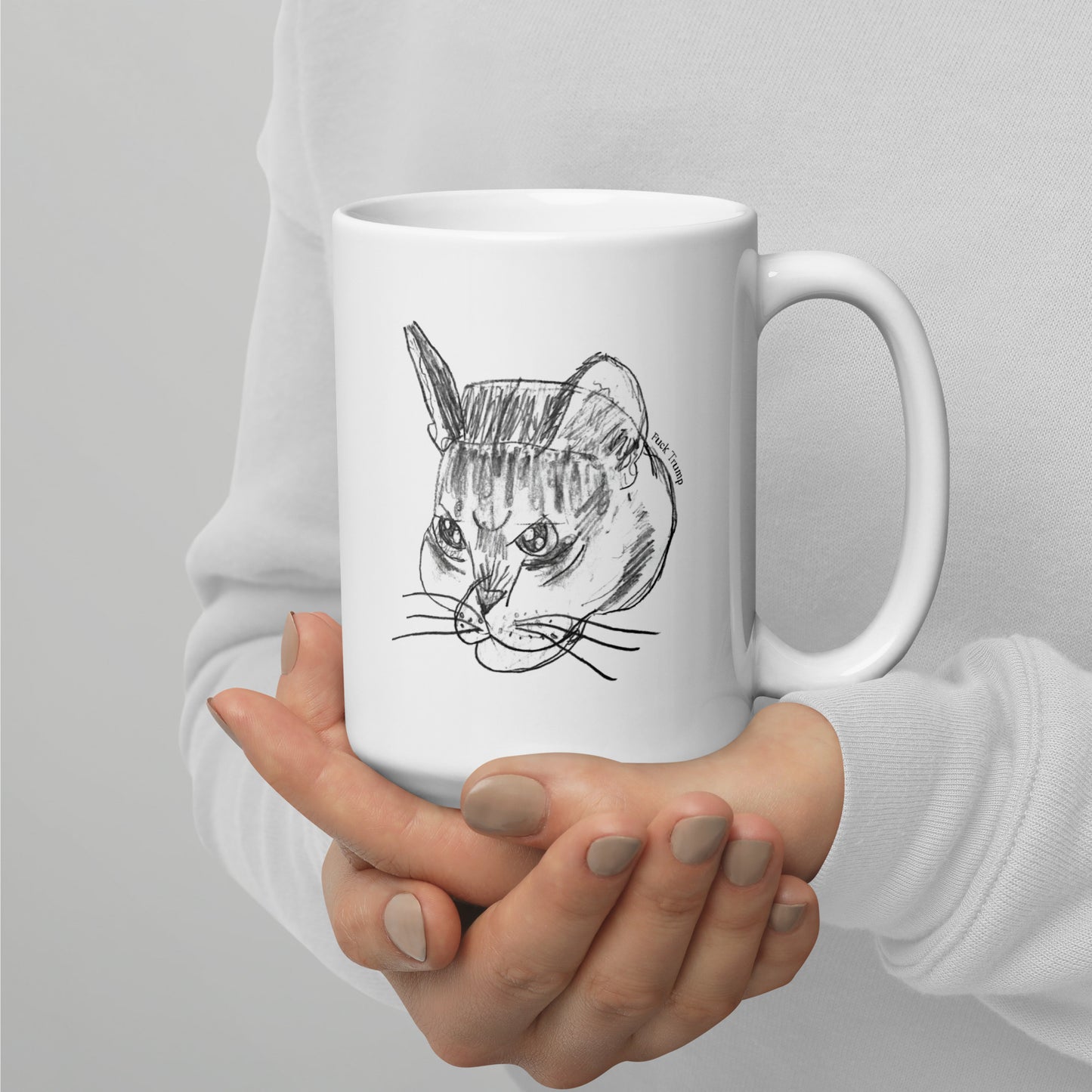 White 15 oz glossy mug featuring a funny cat illustration with a subtle anti-Trump message.