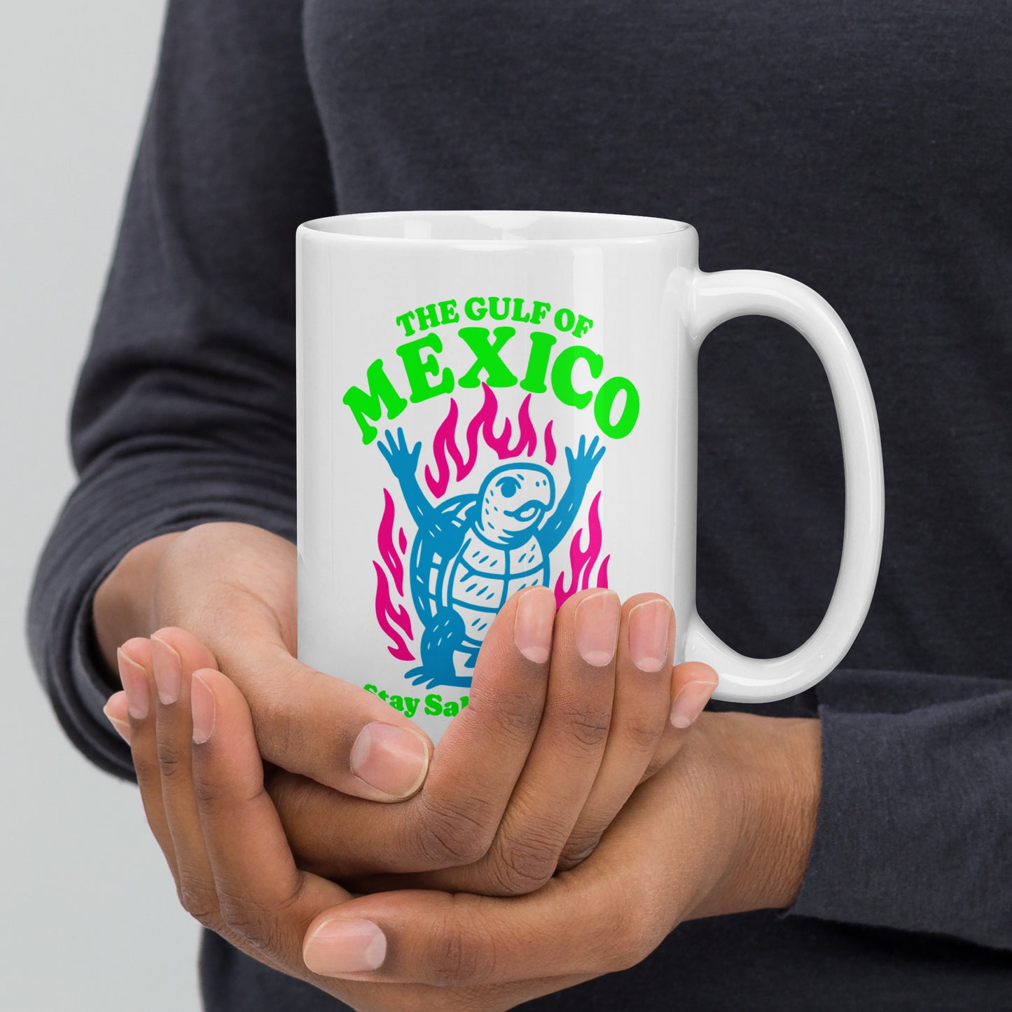 Front View Image: “Front view of 15 oz white ceramic mug featuring sea turtle and 'Stay Salty & Resist' slogan”