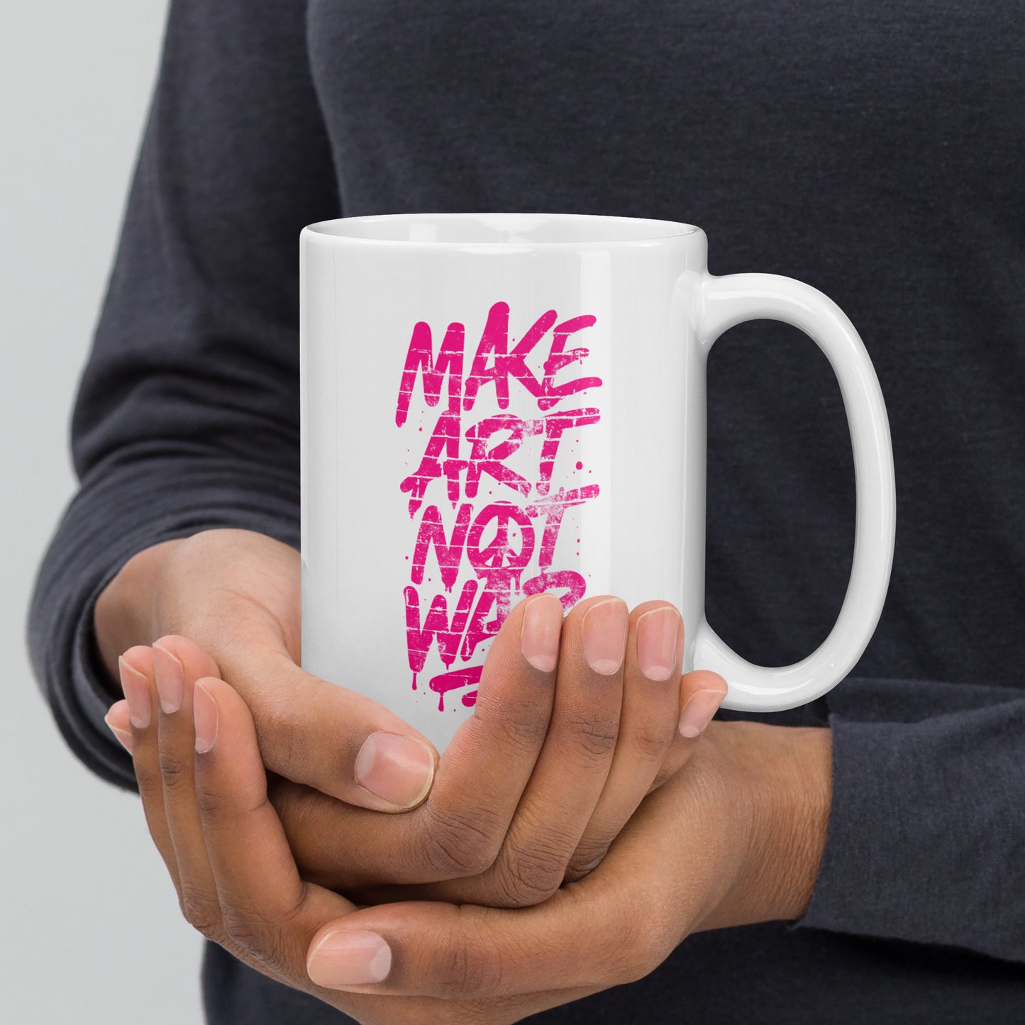 Front View Image: Front view of the 15 oz glossy mug with Make Art Not War graffiti design in pink spray-paint lettering
