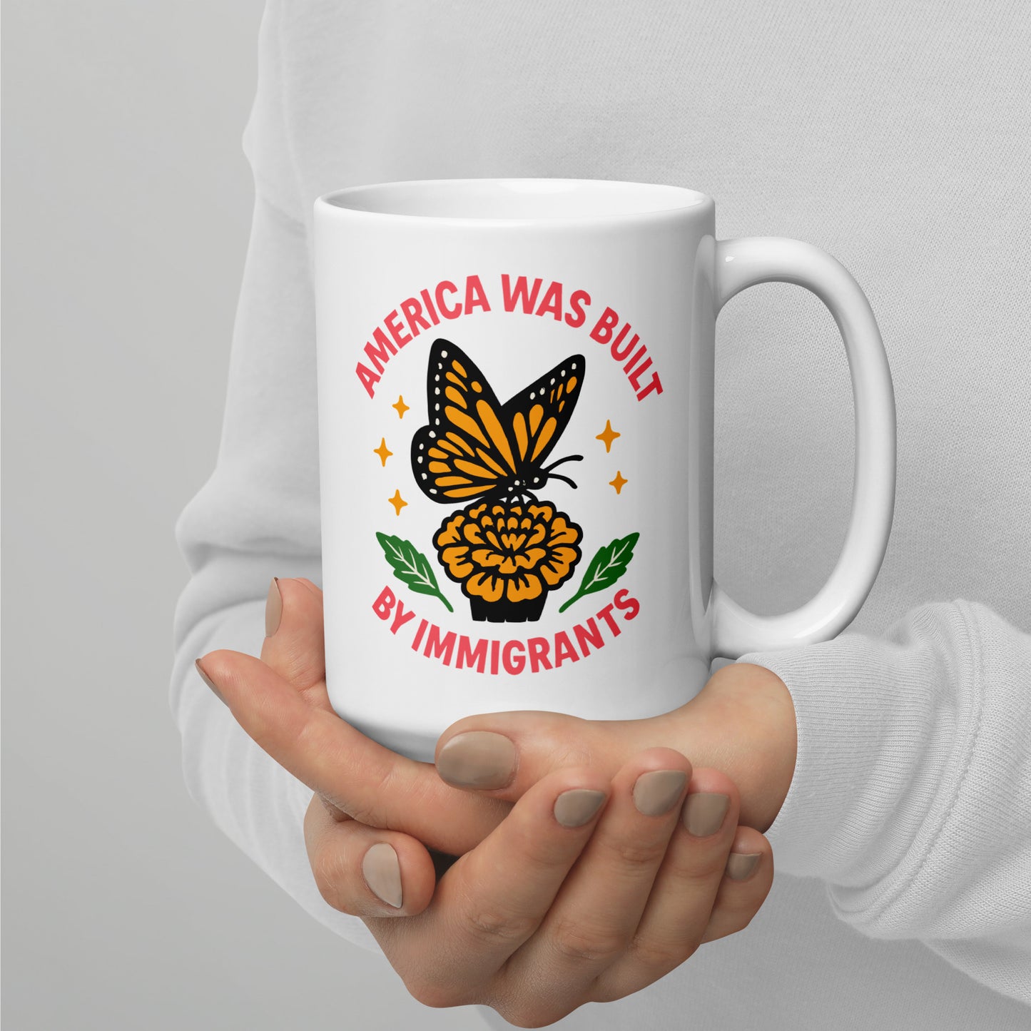 15 oz “America Was Built by Immigrants” graphic mug featuring monarch butterfly artwork, Blue Wave progressive home & lifestyle mug for activists.