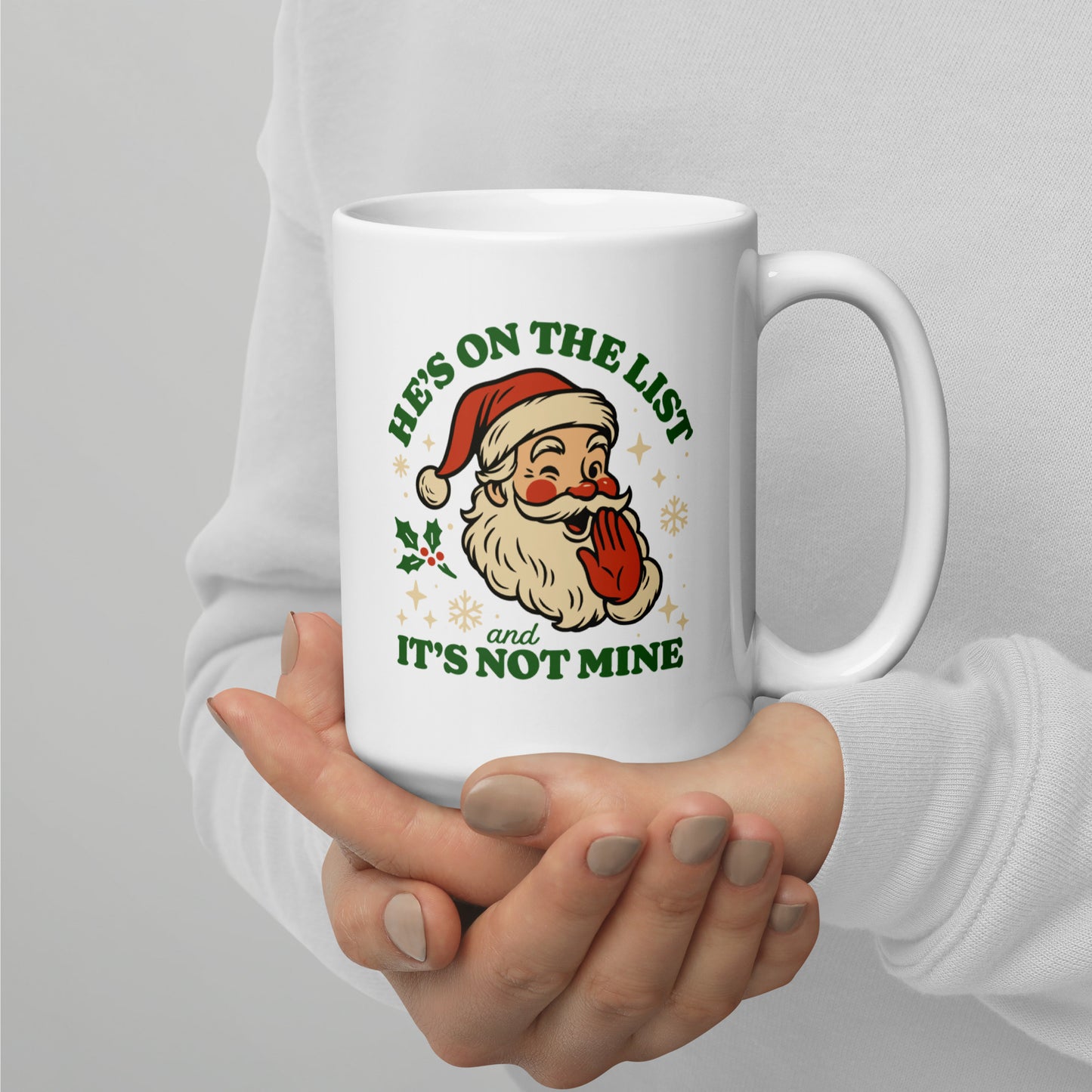 A person presenting the Christmas mug with the full Santa graphic and “It’s Not Mine” text, highlighting the warm vintage holiday artwork from Blue Wave USA.