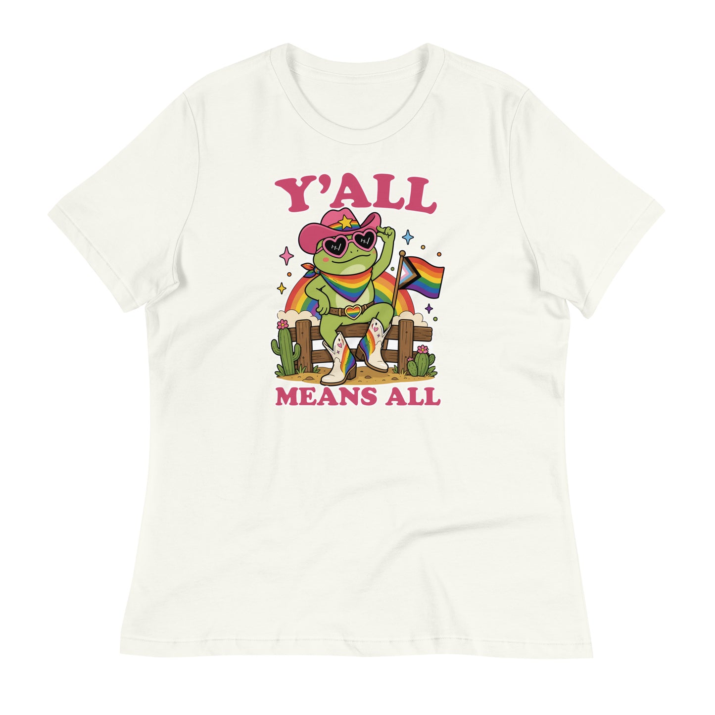 Vintage white women’s t-shirt featuring a rainbow cowboy frog in heart-shaped sunglasses with pride flag accents and bold “Y’All Means All” message promoting inclusion and belonging.
