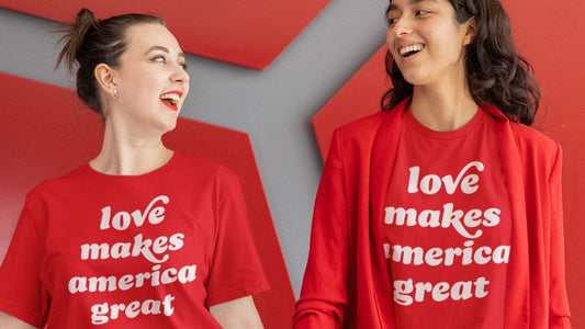 Women wearing red "love makes america great" graphic tees, ideal for Valentine's Day gifts.