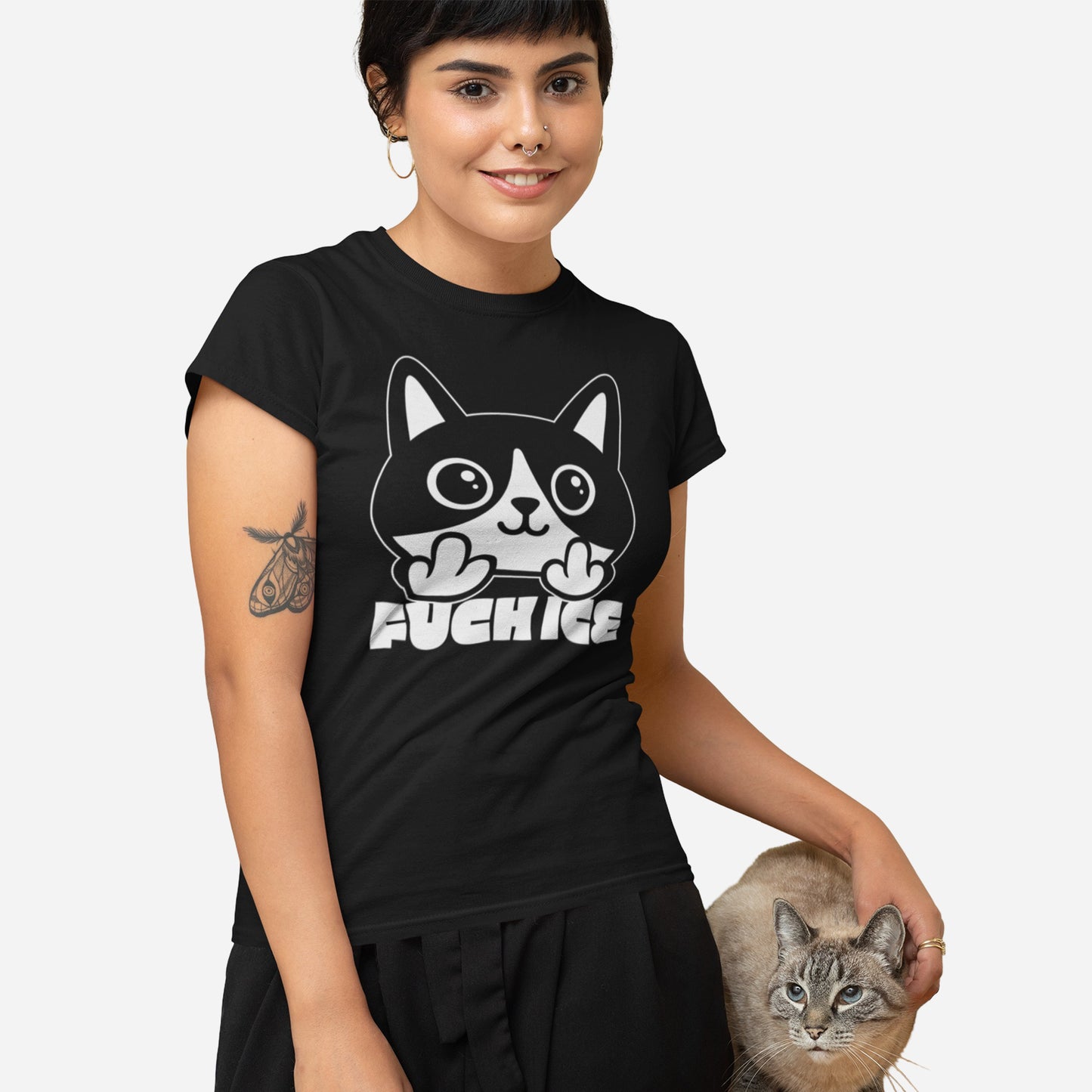 Model wearing black women’s relaxed t-shirt with bold graphic cat illustration giving the middle finger, high-contrast white print, centered design, printed message “FUCK ICE.”