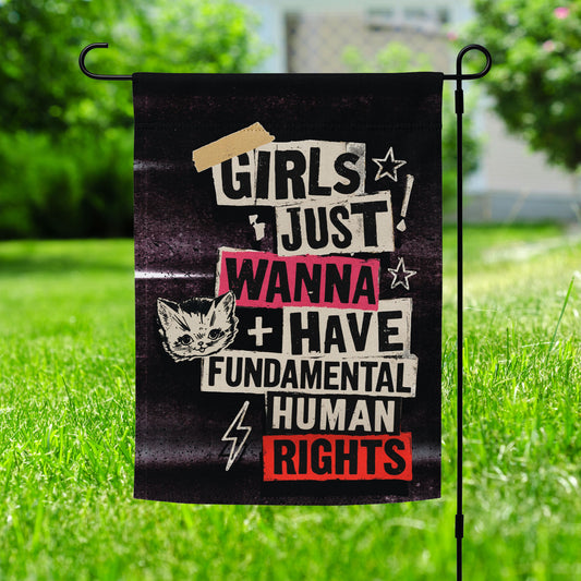 Lifestyle Image: Garden setting with Girls Just Wanna Have Fundamental Human Rights Punk Flag proudly displayed out in the yard