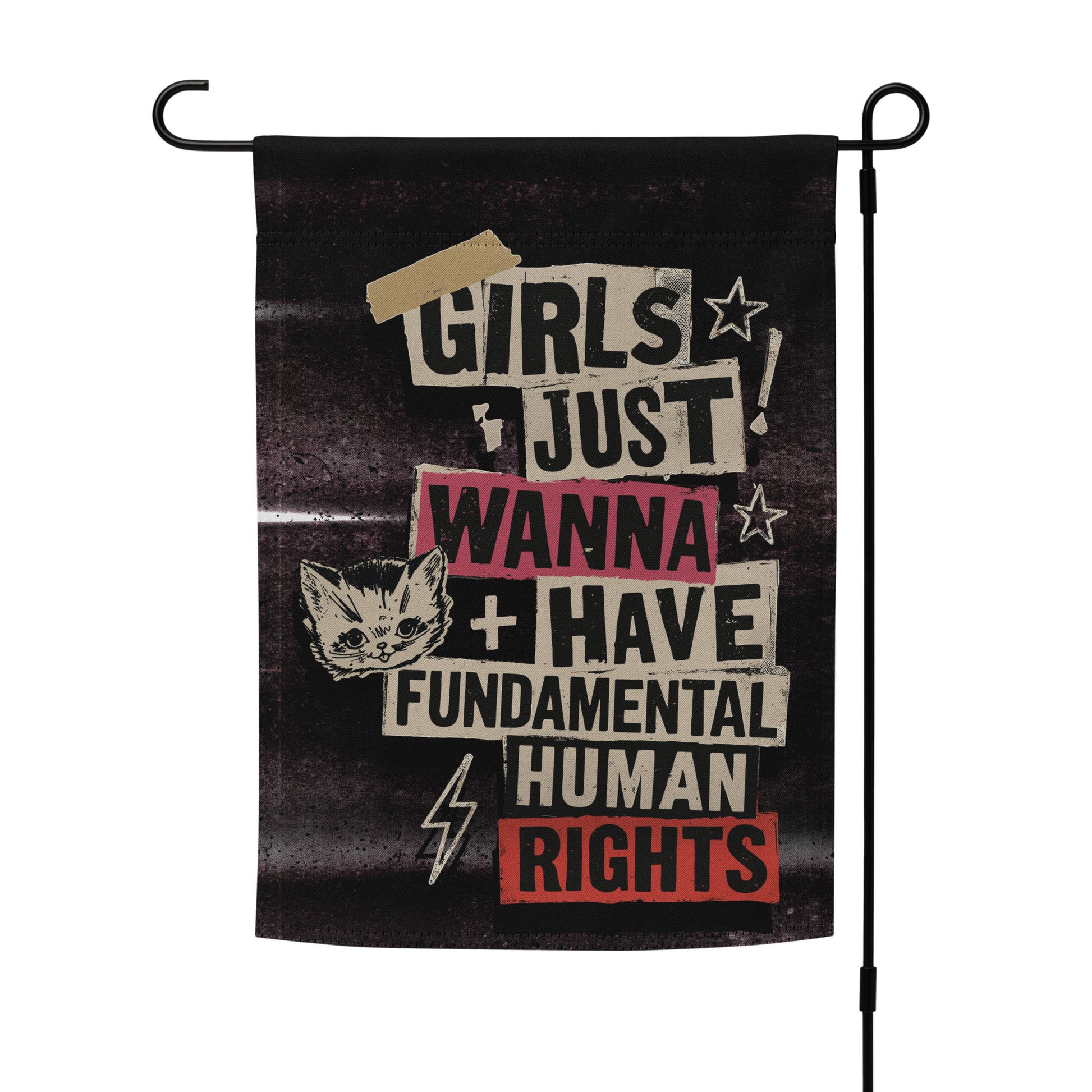 Political garden flag with text 'Girls just wanna have fundamental human rights' and a cat illustration displayed on stand