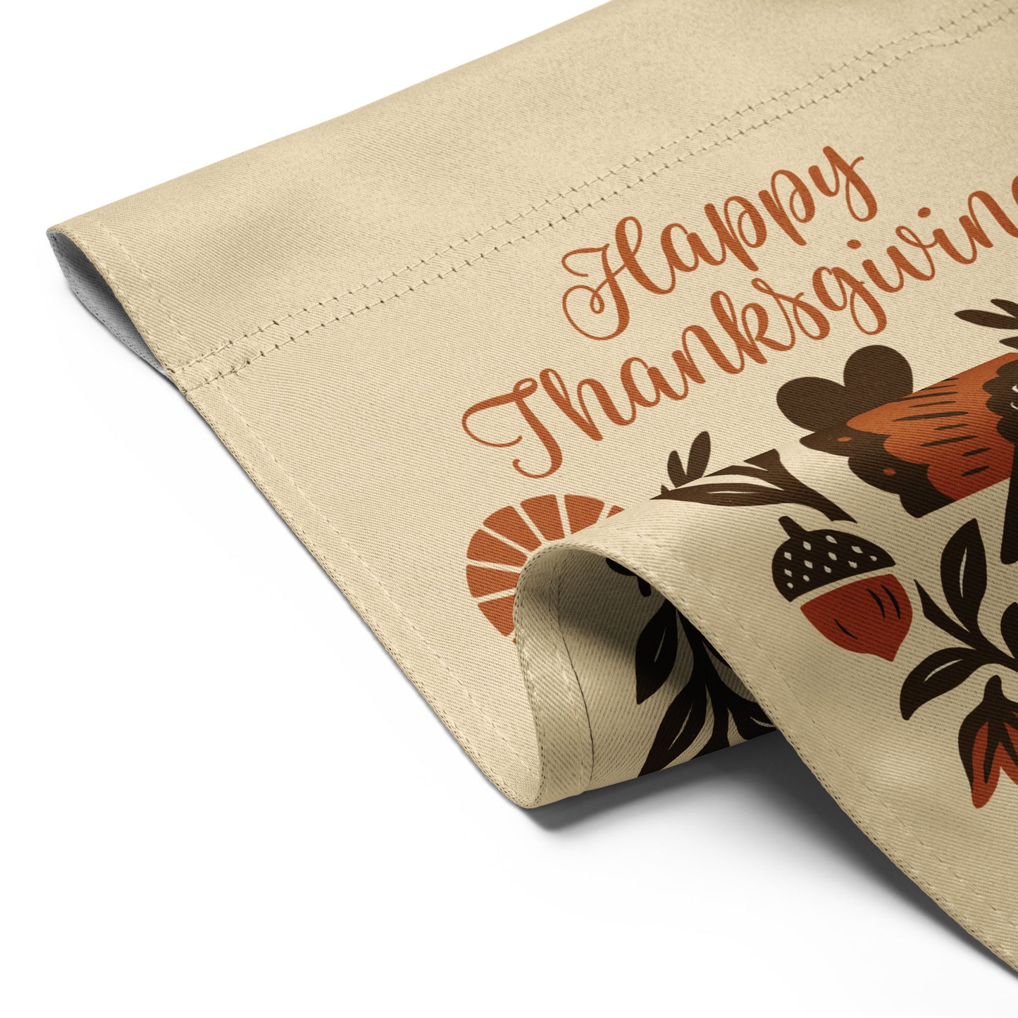 Close-up of the “Happy Thanksgiving – Celebrating Immigrants Since 1620” garden flag showing stitched hem and partial turkey/lettering detail.