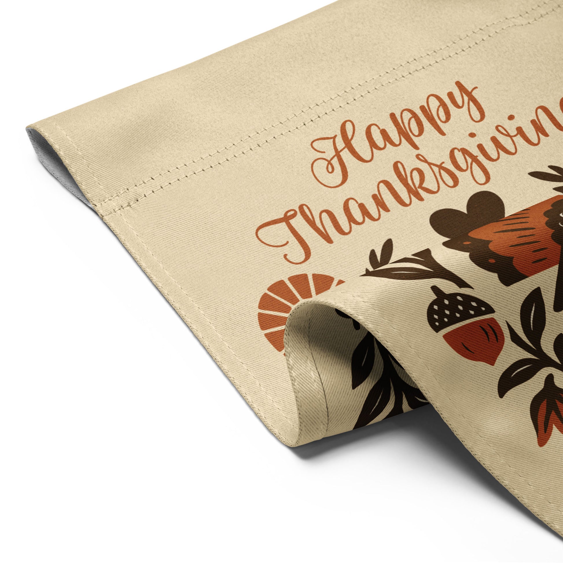 Close-up of the “Happy Thanksgiving – Celebrating Immigrants Since 1620” garden flag showing stitched hem and partial turkey/lettering detail.