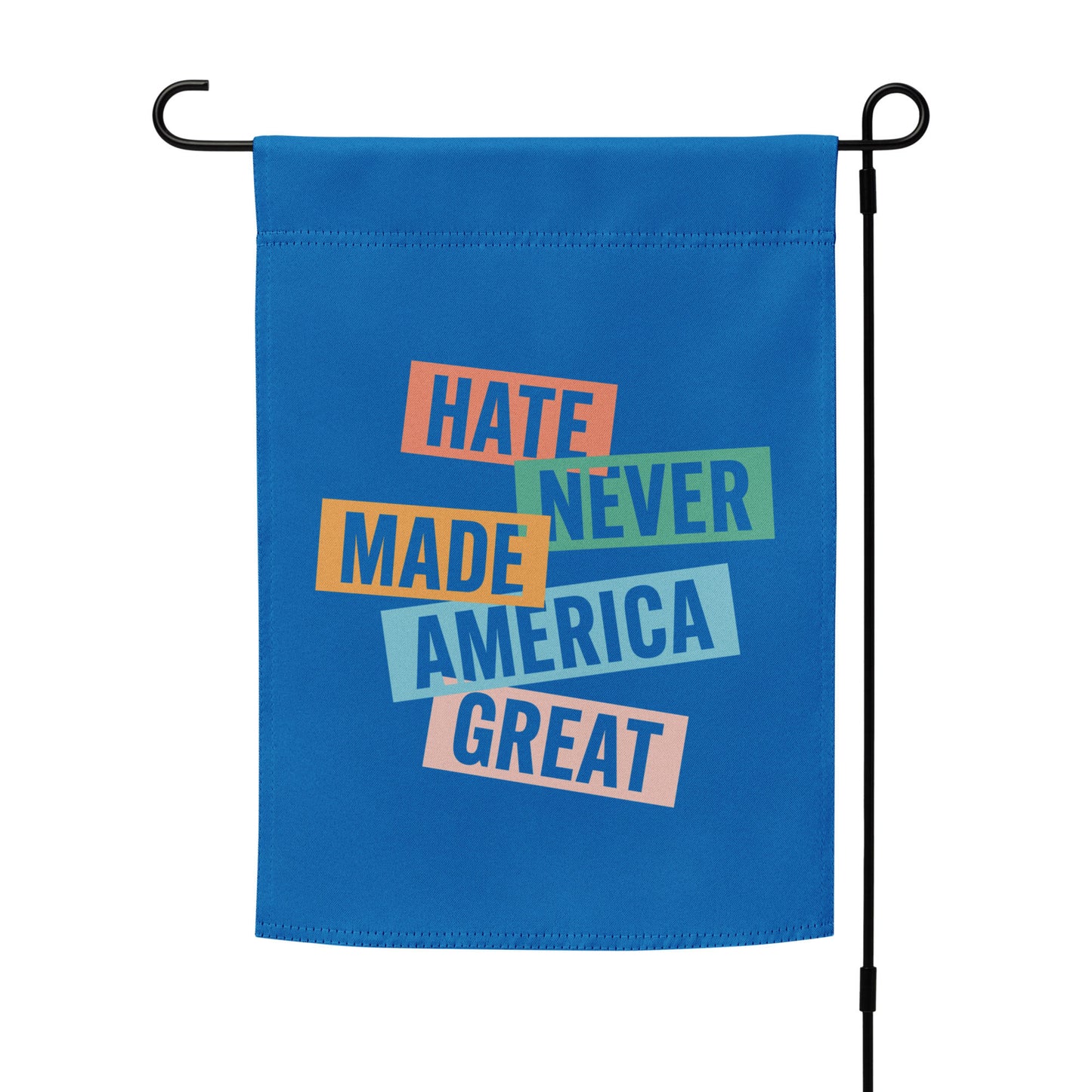 Progressive garden flag hanging vertically on metal stand featuring stacked typographic design, centered layout, social justice outdoor decor.