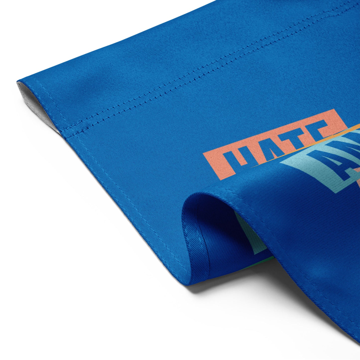 Detail view of blue progressive garden flag fabric edge and stitching, stacked typography artwork visible, durable activist garden decor.