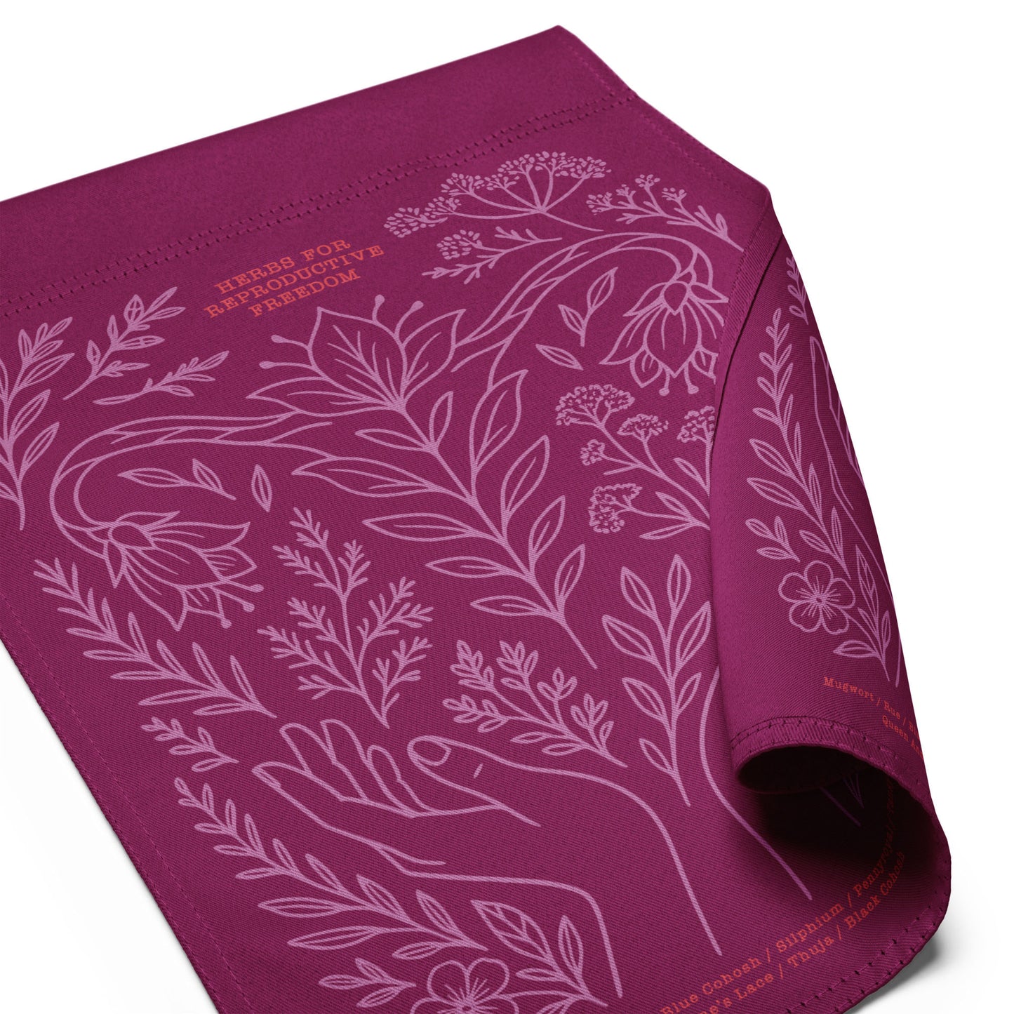 Close-up of the magenta double-sided garden flag showing lavender floral artwork, crescent moon, and delicate printed detailing.