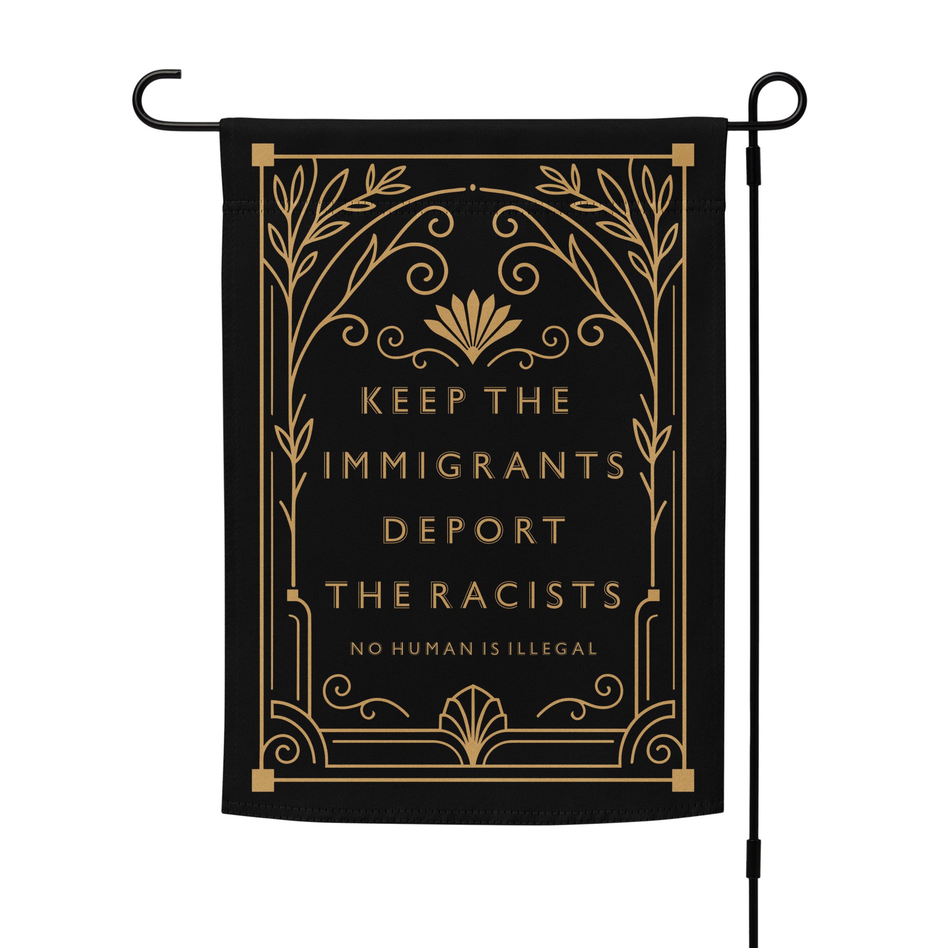 Keep The Immigrants Deport The Racists Garden Flag displayed on a stand