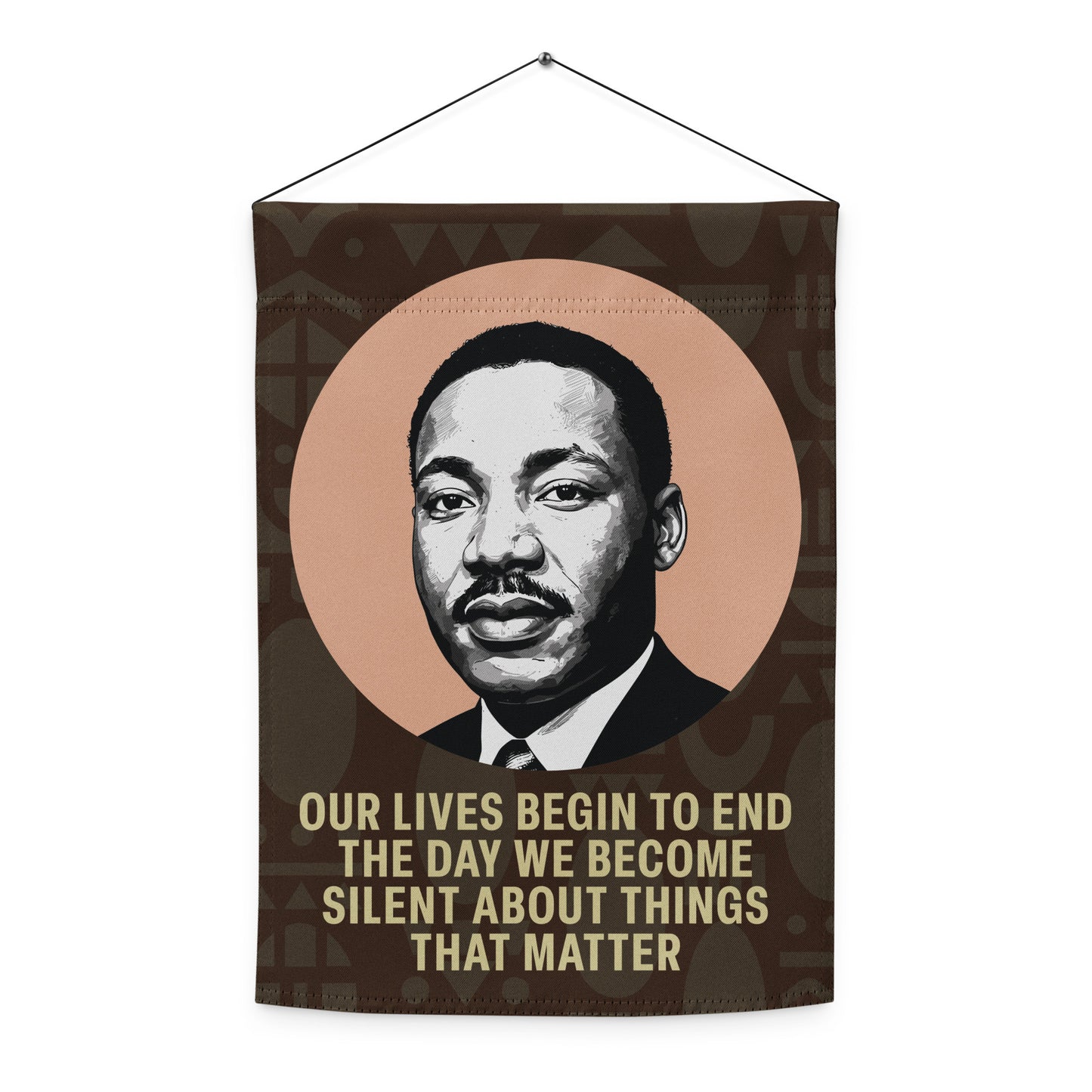 A hanging wall-style version of the garden flag printed with MLK’s portrait and the quote “OUR LIVES BEGIN TO END THE DAY WE BECOME SILENT ABOUT THINGS THAT MATTER,” shown indoors. Blue Wave USA product.