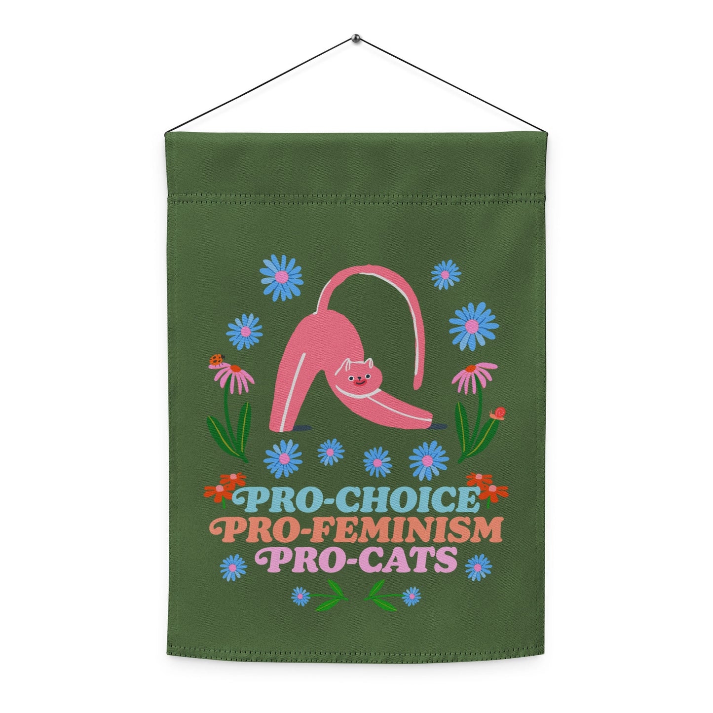 Indoor hanging view of the garden flag, showing the full folk-art cat illustration and floral layout with playful text reading “PRO-CHOICE PRO-FEMINISM PRO-CATS,” from Blue Wave USA.