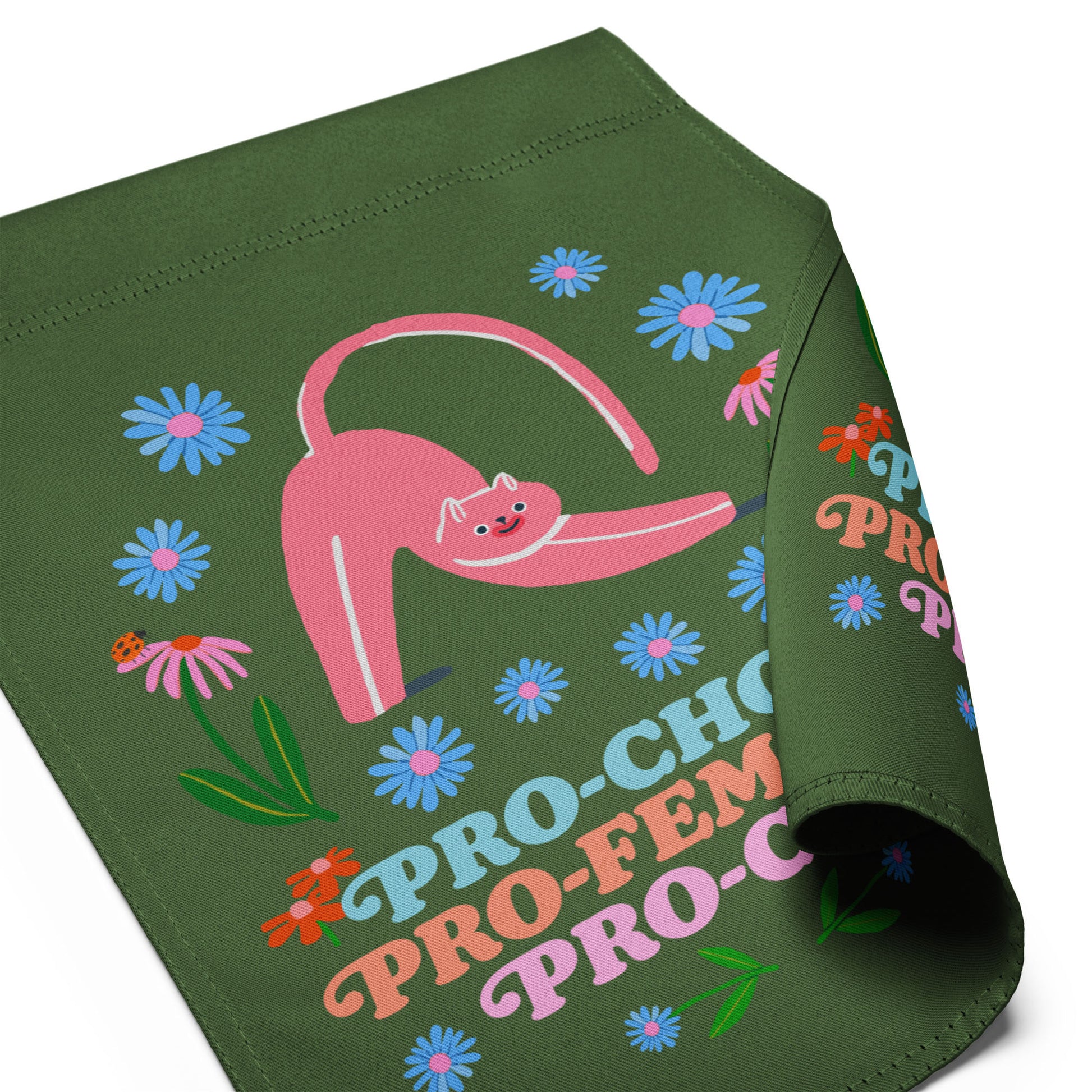 Folded green garden flag shown flat, highlighting the colorful folk-art cat illustration, floral details, and playful typography reading “PRO-CHOICE PRO-FEMINISM PRO-CATS.”