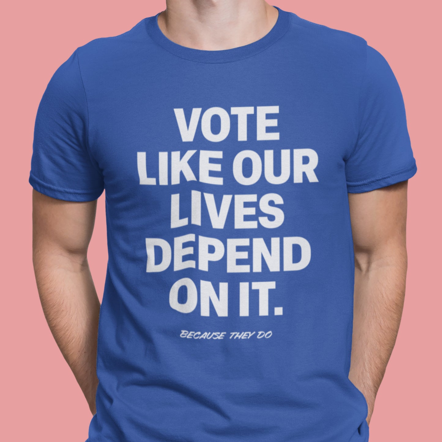 Person wearing a royal blue Vote Like Our Lives Depend On It t-shirt. The strong white lettering stands out as a statement of urgency, solidarity, and shared responsibility.