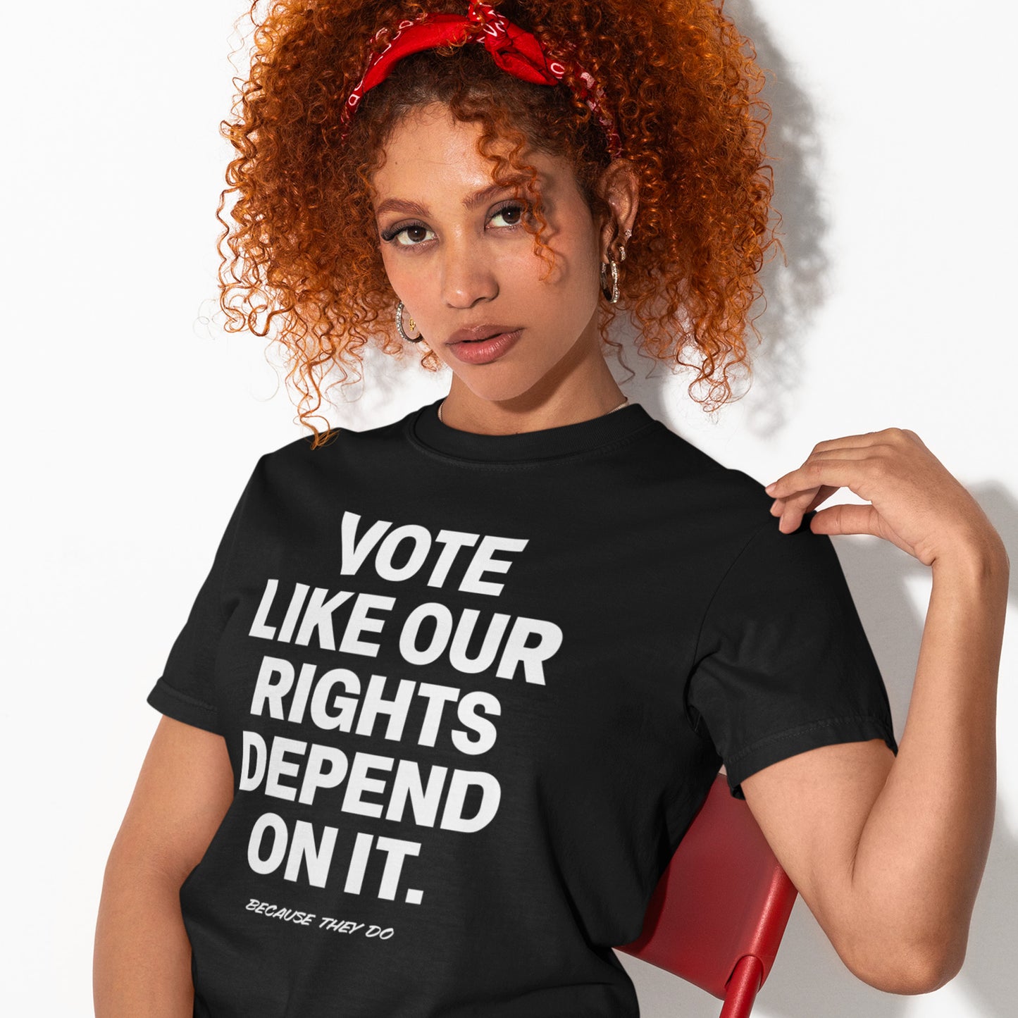 Woman wearing black civic engagement t-shirt featuring bold “Vote Like Our Rights Depend On It” message, promoting voter participation, democracy, and election awareness.