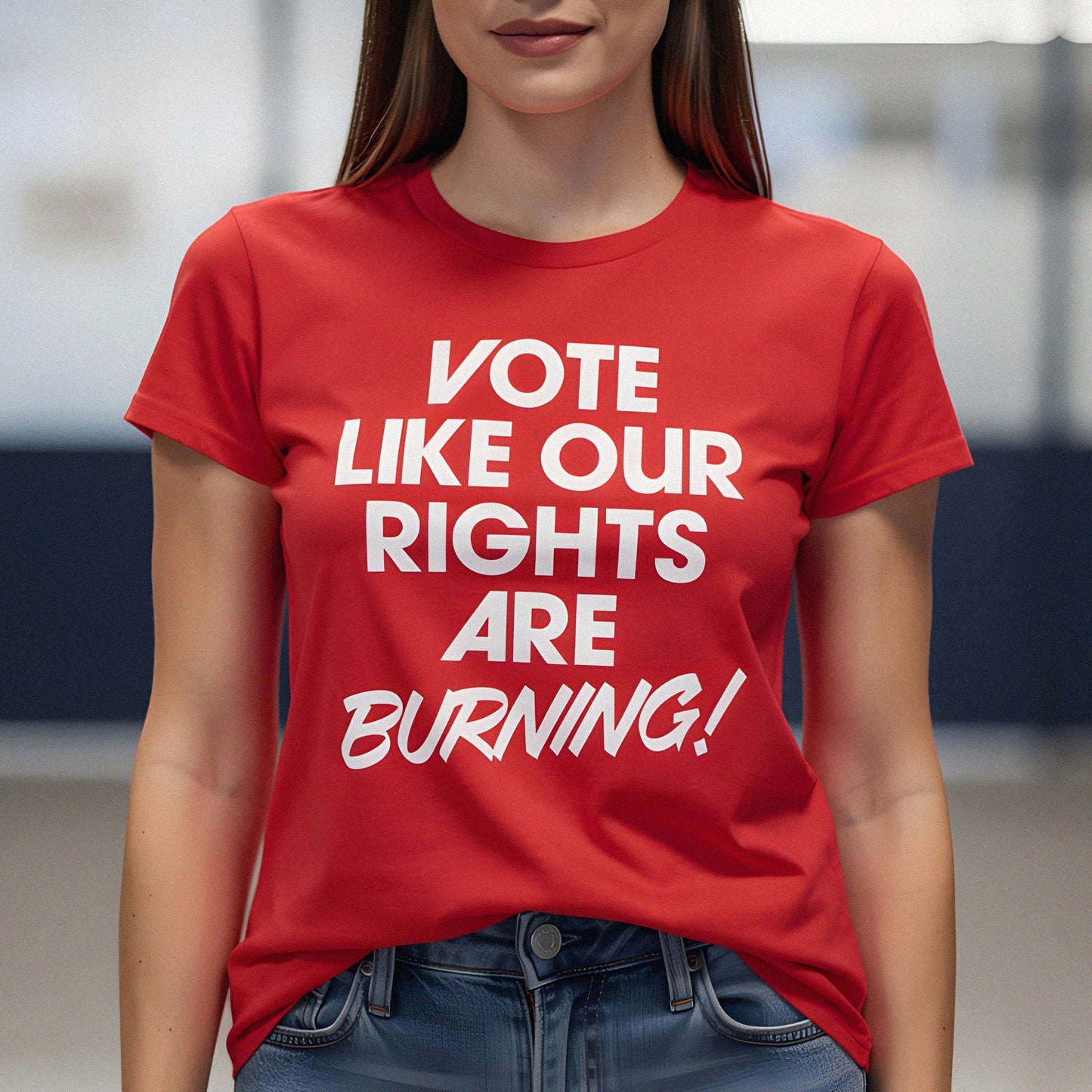 Woman wearing red voting rights t-shirt featuring bold “Vote Like Our Rights Are Burning!” typography, highlighting civic engagement, democracy, and progressive political activism.