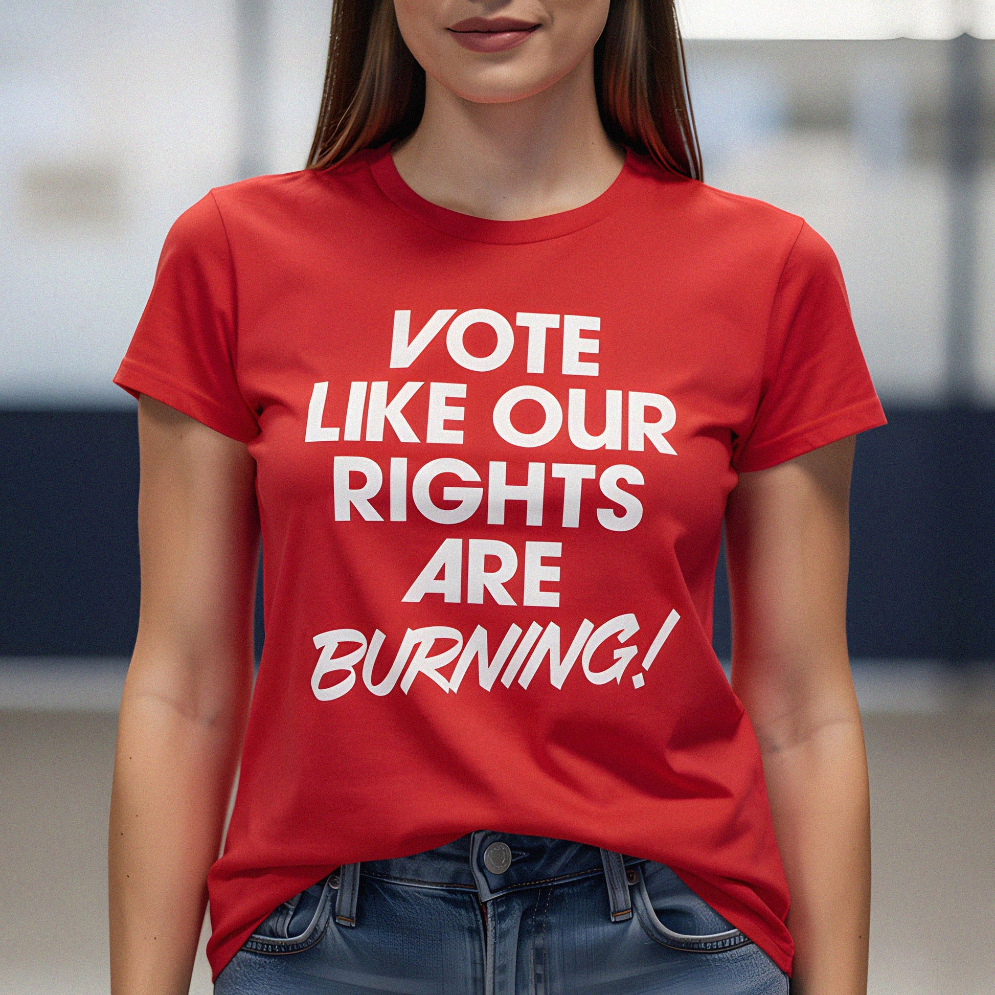 Woman wearing red voting rights t-shirt featuring bold “Vote Like Our Rights Are Burning!” typography, highlighting civic engagement, democracy, and progressive political activism.