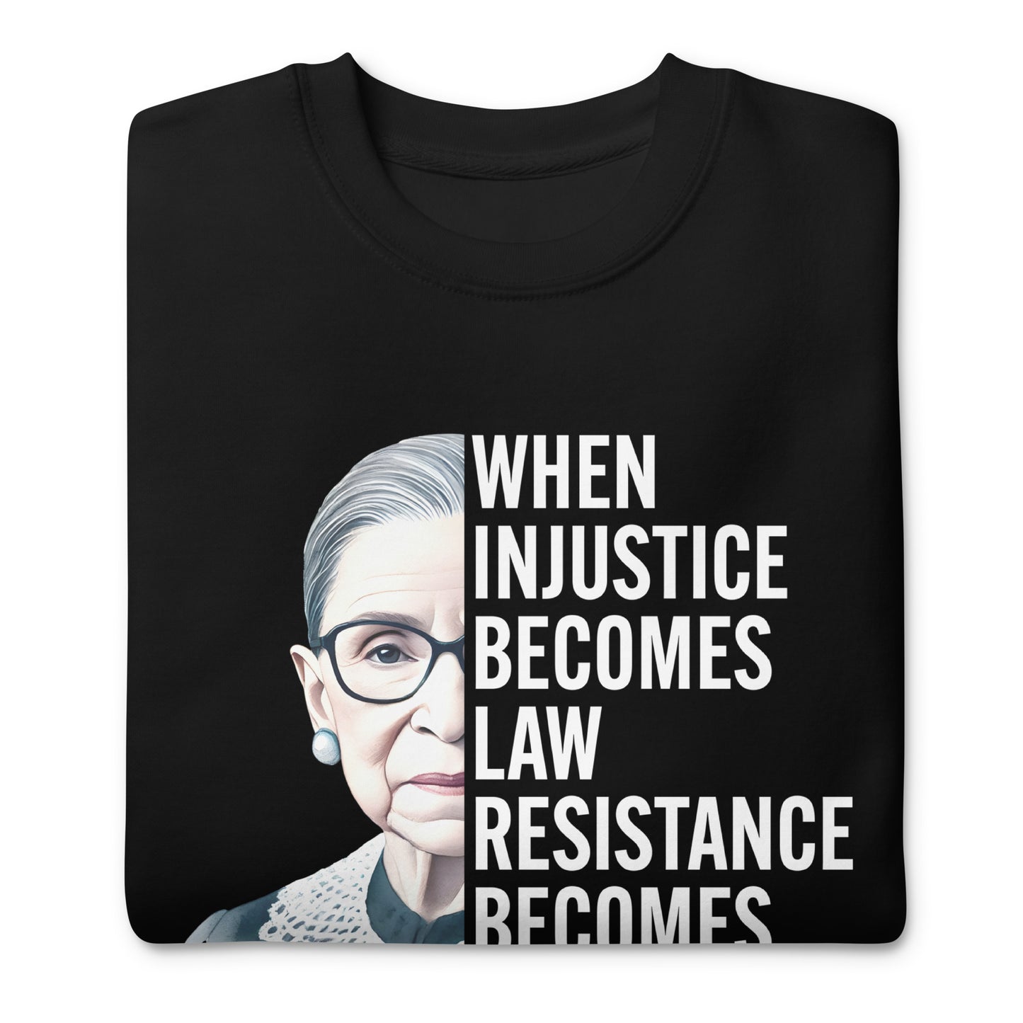 Folded black unisex premium sweatshirt featuring Ruth Bader Ginsburg portrait graphic with centered progressive typography.