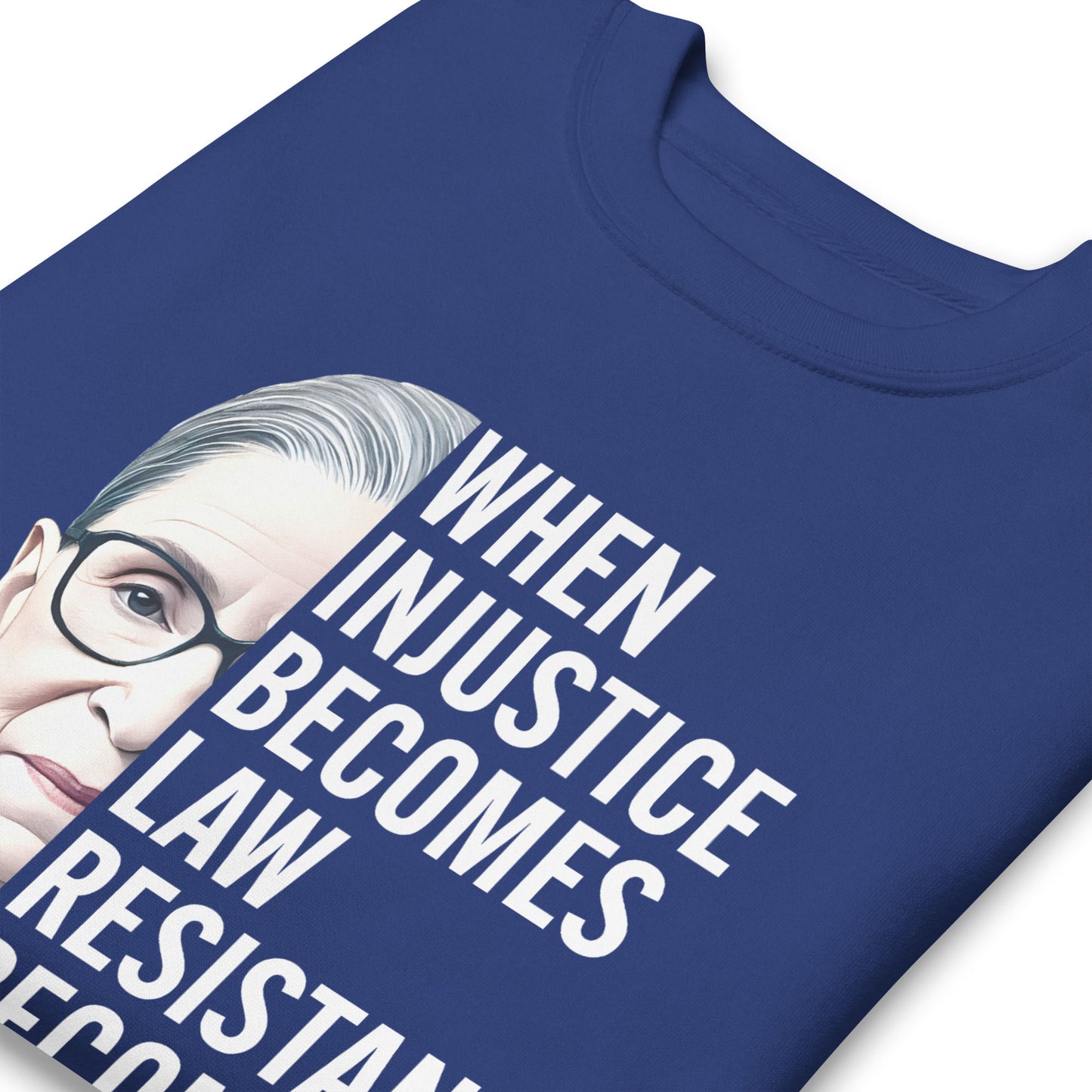 Close-up of blue unisex premium sweatshirt showing Ruth Bader Ginsburg portrait and stacked typography, progressive activist apparel from Blue Wave USA.