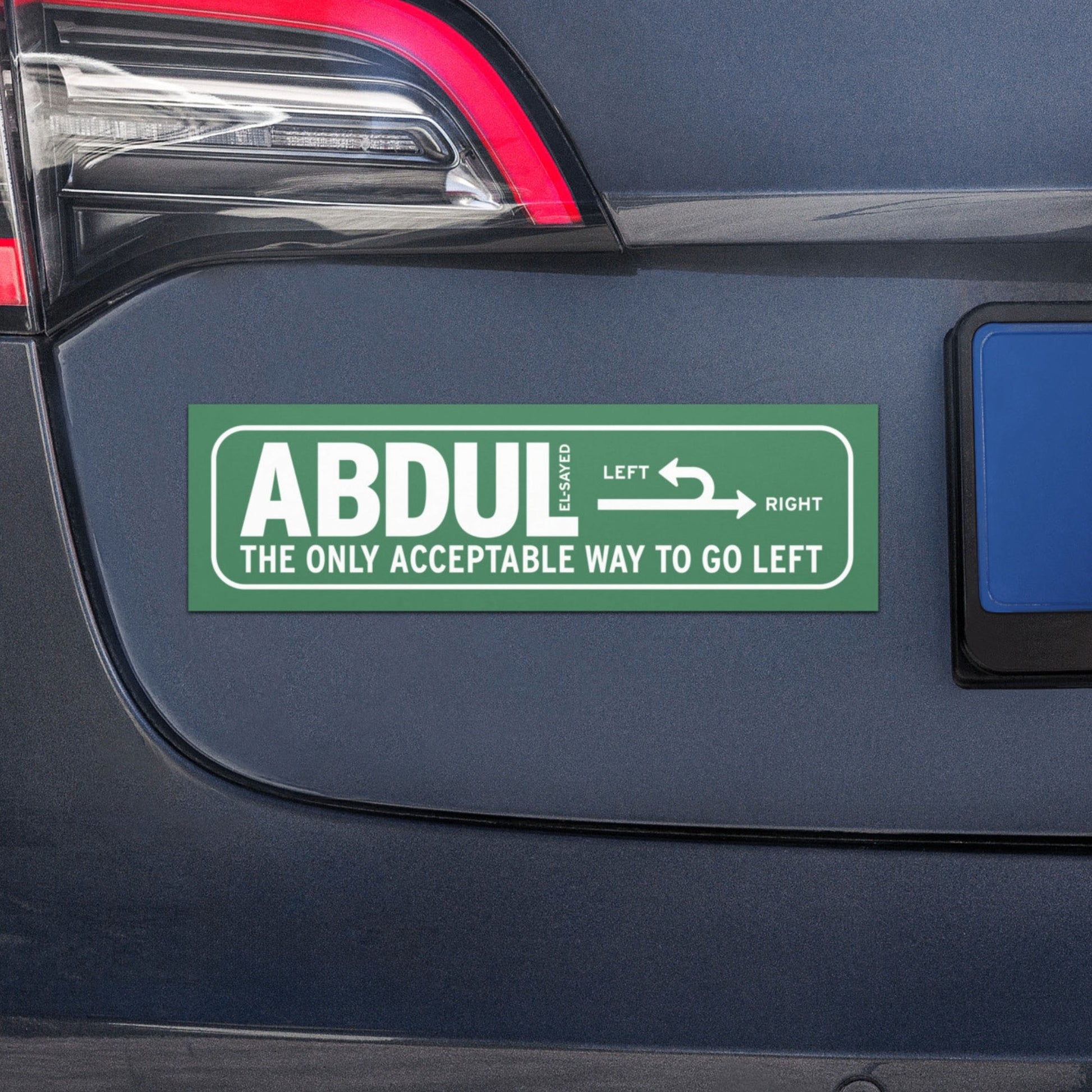 Michigan left road sign car magnet with “Abdul El-Sayed” text displayed on vehicle bumper in retro highway-inspired political design.