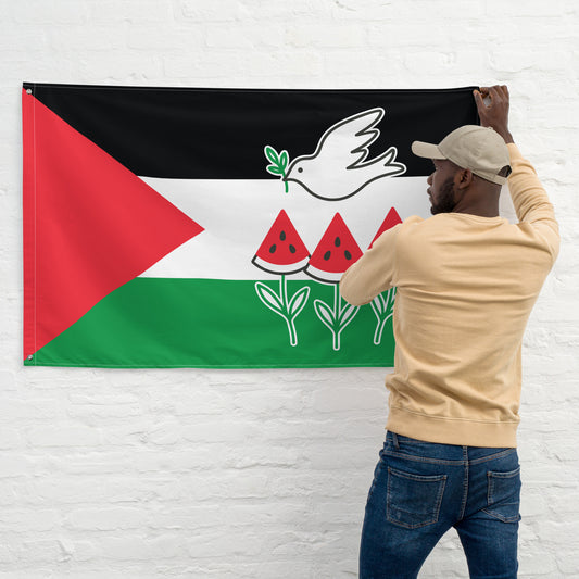 Person hanging a Free Palestine wall flag featuring a white dove with olive branch and three watermelon slices on red, white, green, and black design.