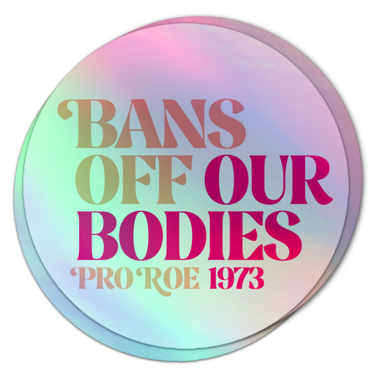 Pro-choice holographic sticker reading “Bans Off Our Bodies, Pro Roe 1973” in bold, retro typography.