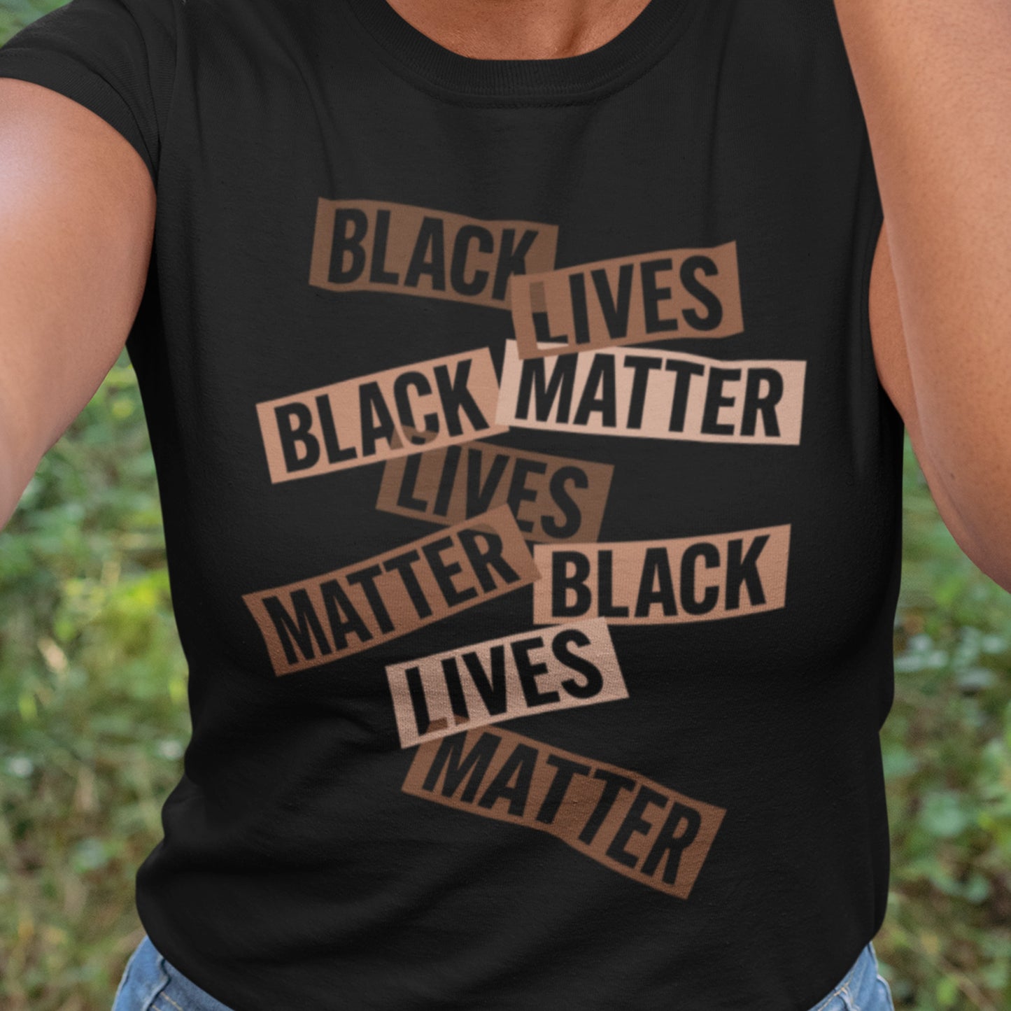 Close-up of a person wearing the Black Lives Matter stacked text design on a sleeveless black tee. The layered typography adds a sense of motion and urgency. Designed for those who move through the world with purpose — by Blue Wave USA.