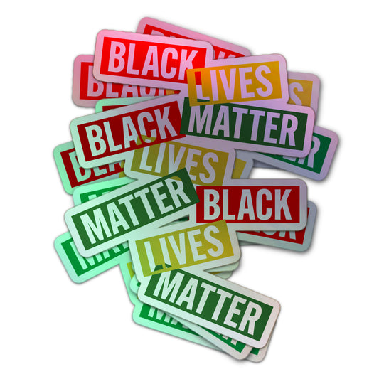 Holographic sticker featuring “Black Lives Matter” repeated in bold red, yellow, and green block letters, symbolizing Pan-African pride and unity.