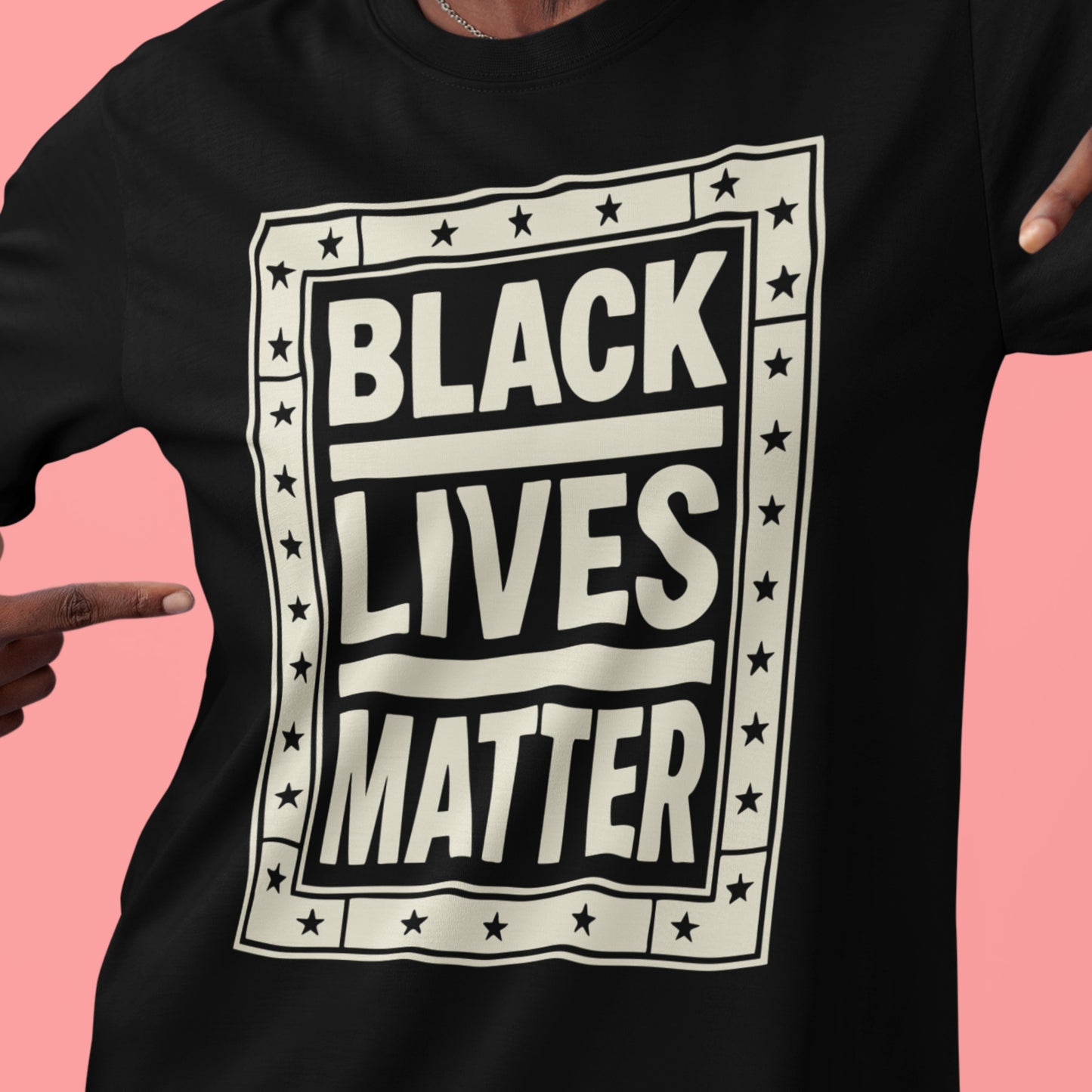 Close-up of the Black Lives Matter tee design — large type, framed with stars, and printed on soft black cotton. A protest essential that never goes out of style.