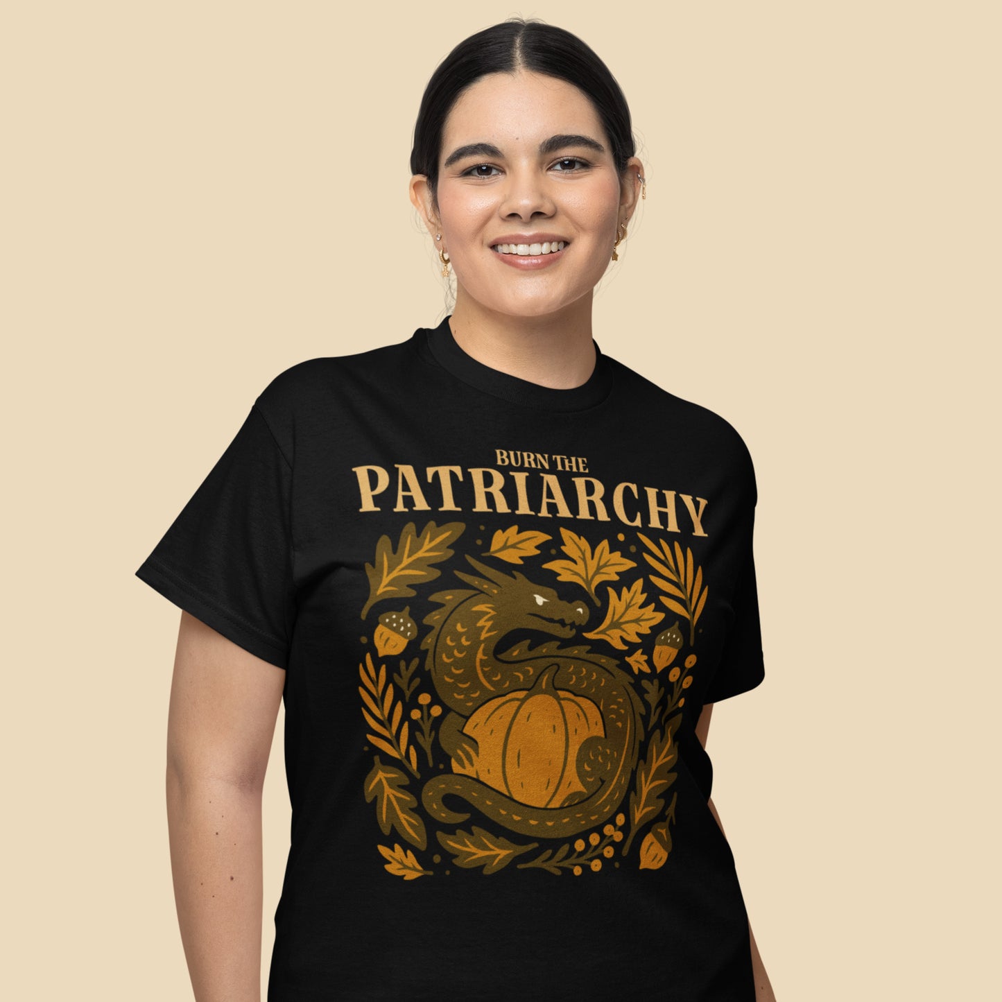 Model wearing “Burn the Patriarchy” dragon and pumpkin feminist tee, Blue Wave USA progressive Thanksgiving shirt celebrating equality.