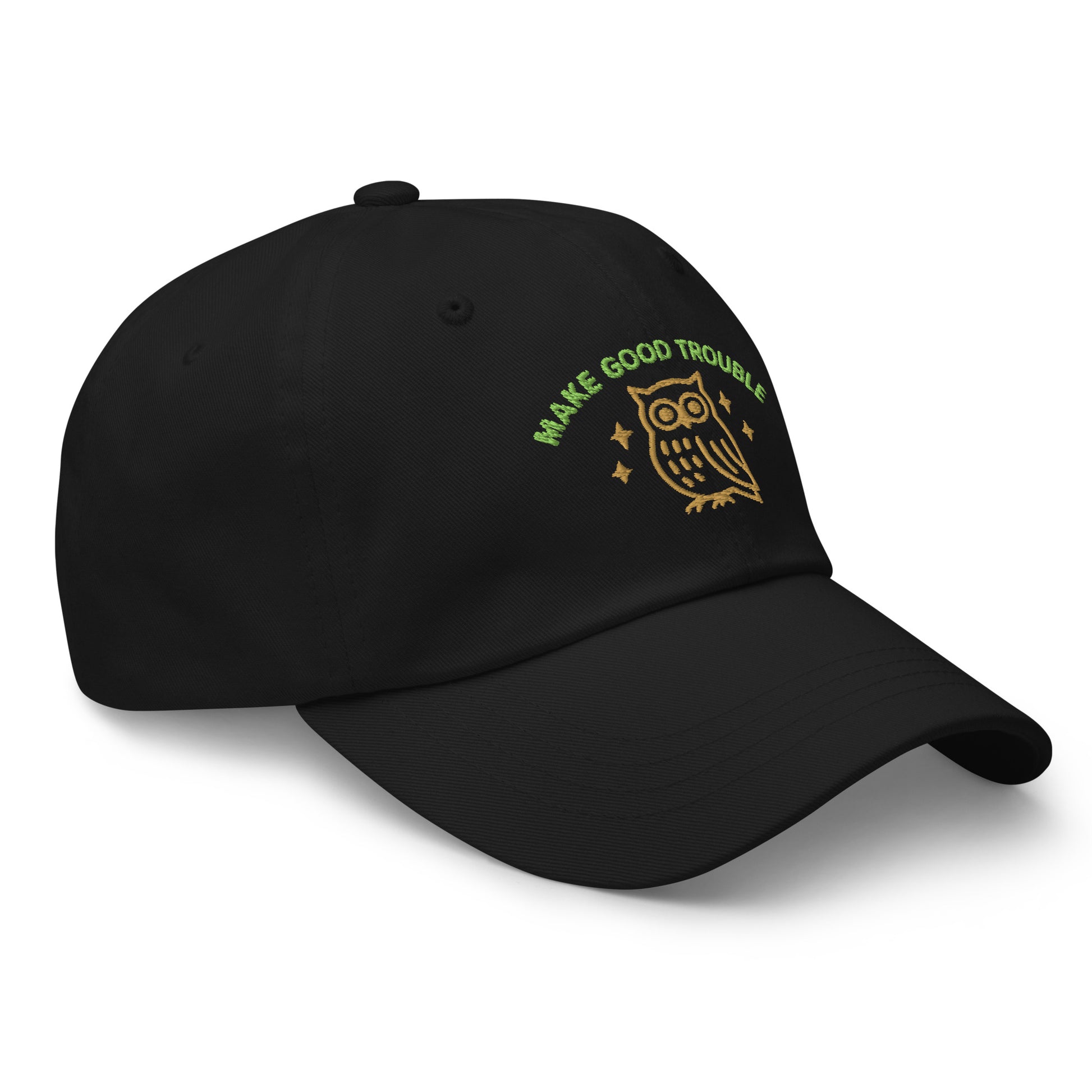 Side Front view of embroidered dad hat with “Make Good Trouble” text and golden owl - Black