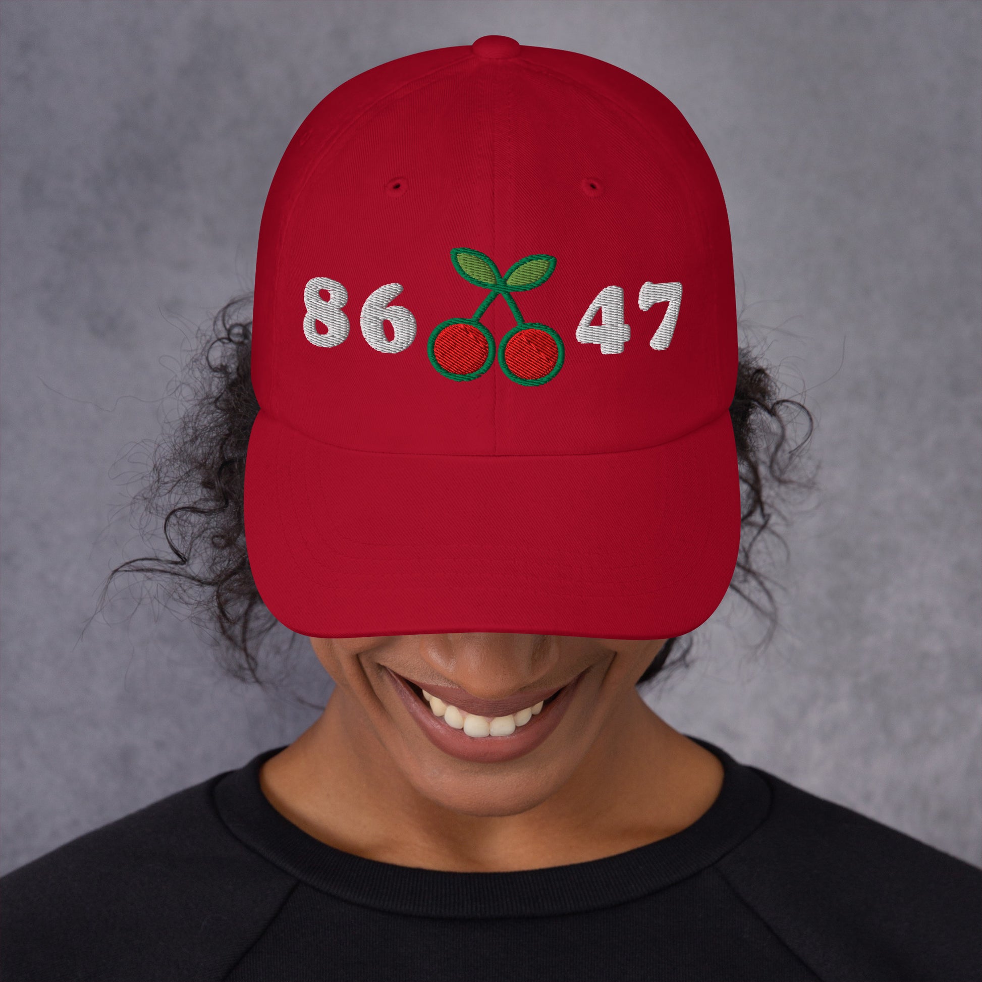 Lifestyle Image: Woman activist Wearing 8647 Anti-Trump Cherry Hat