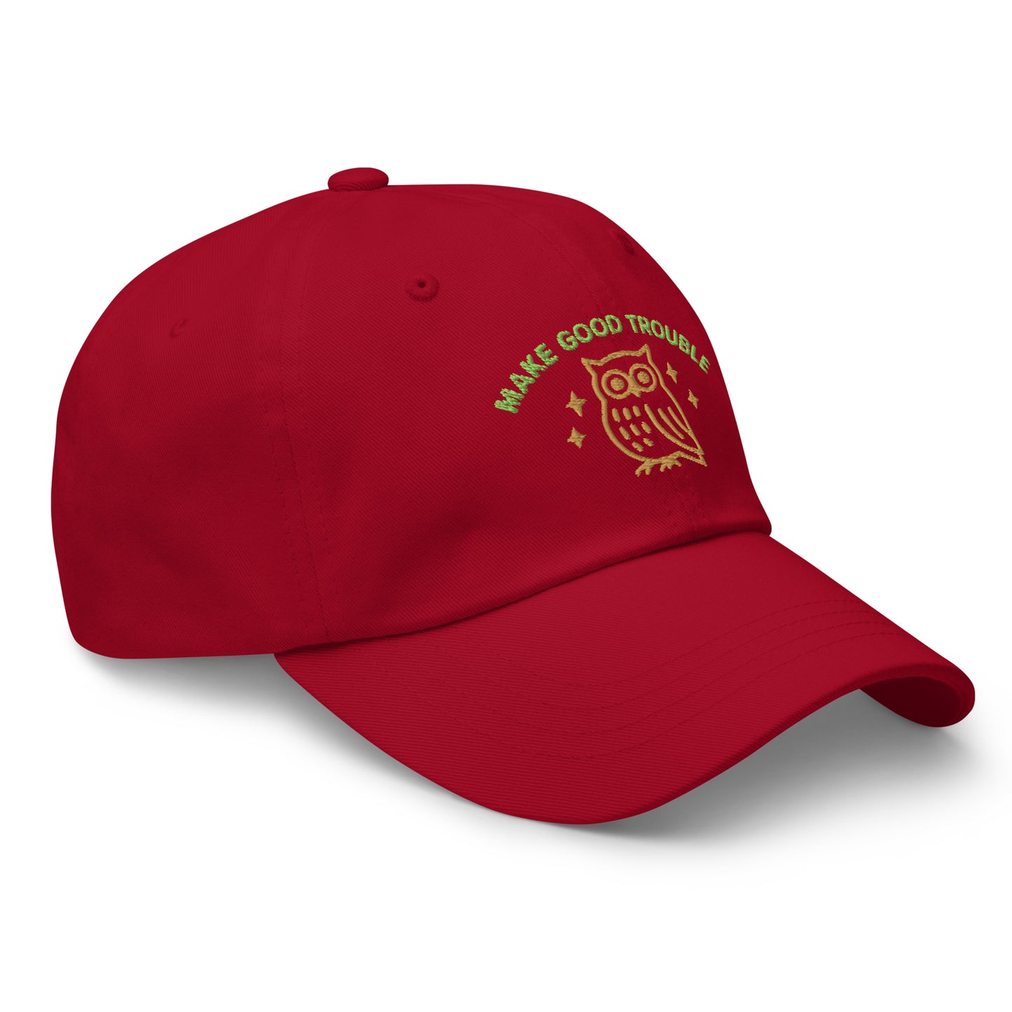 Side Front view of embroidered dad hat with “Make Good Trouble” text and golden owl - Cranberry Red