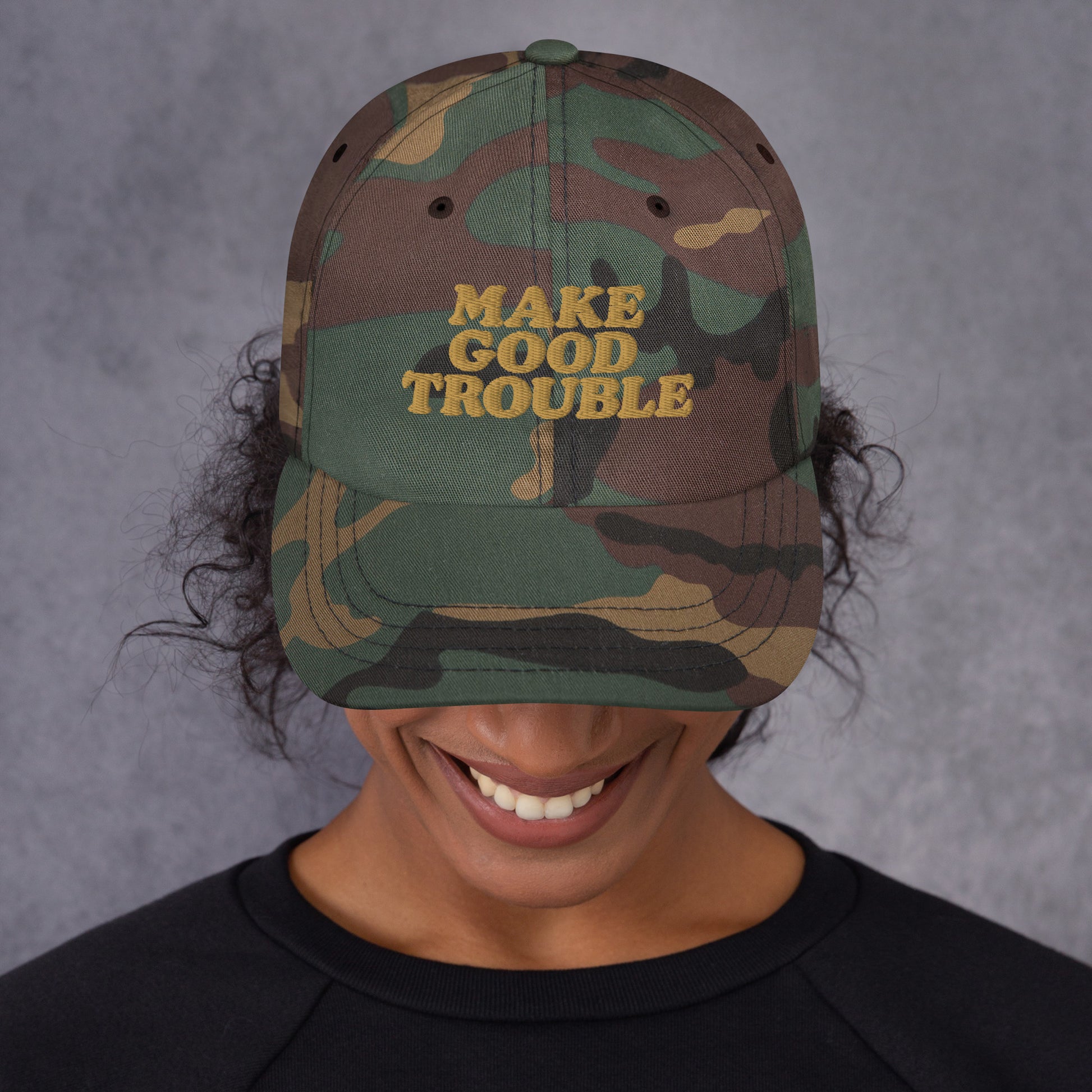 Close up Lifestyle Image: Female protester wearing Make Good Trouble hat