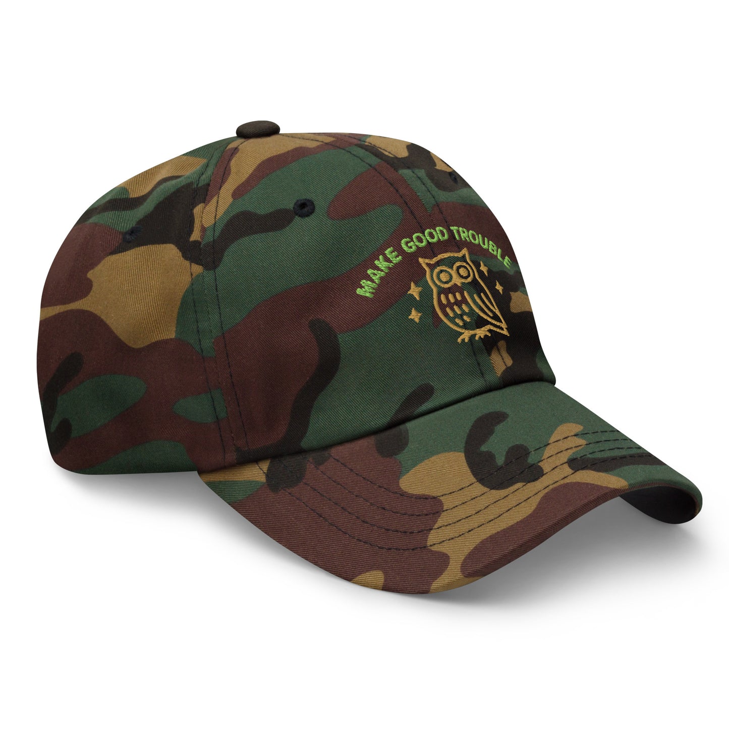 Side Front view of embroidered dad hat with “Make Good Trouble” text and golden owl - Green Camo