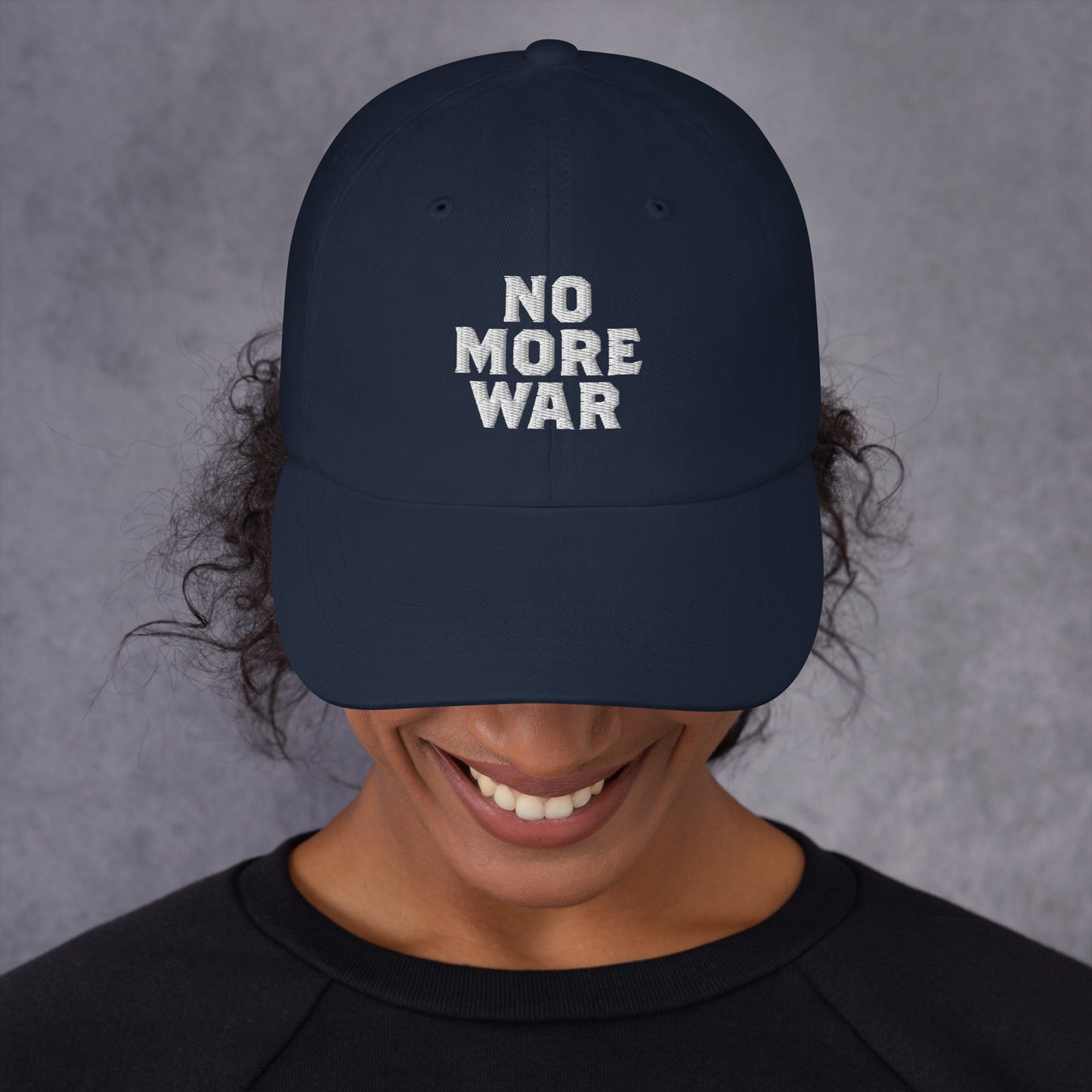 Female model wearing the No More War Anti-War Peace Activist Dad Hat