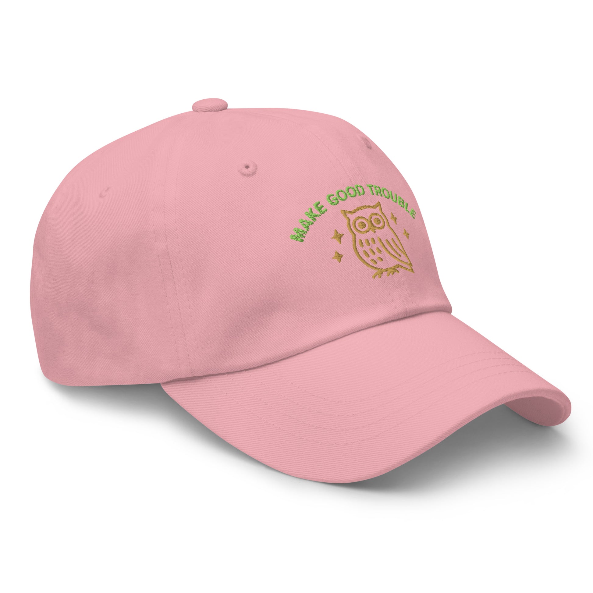 Side Front view of embroidered dad hat with “Make Good Trouble” text and golden owl - Pink