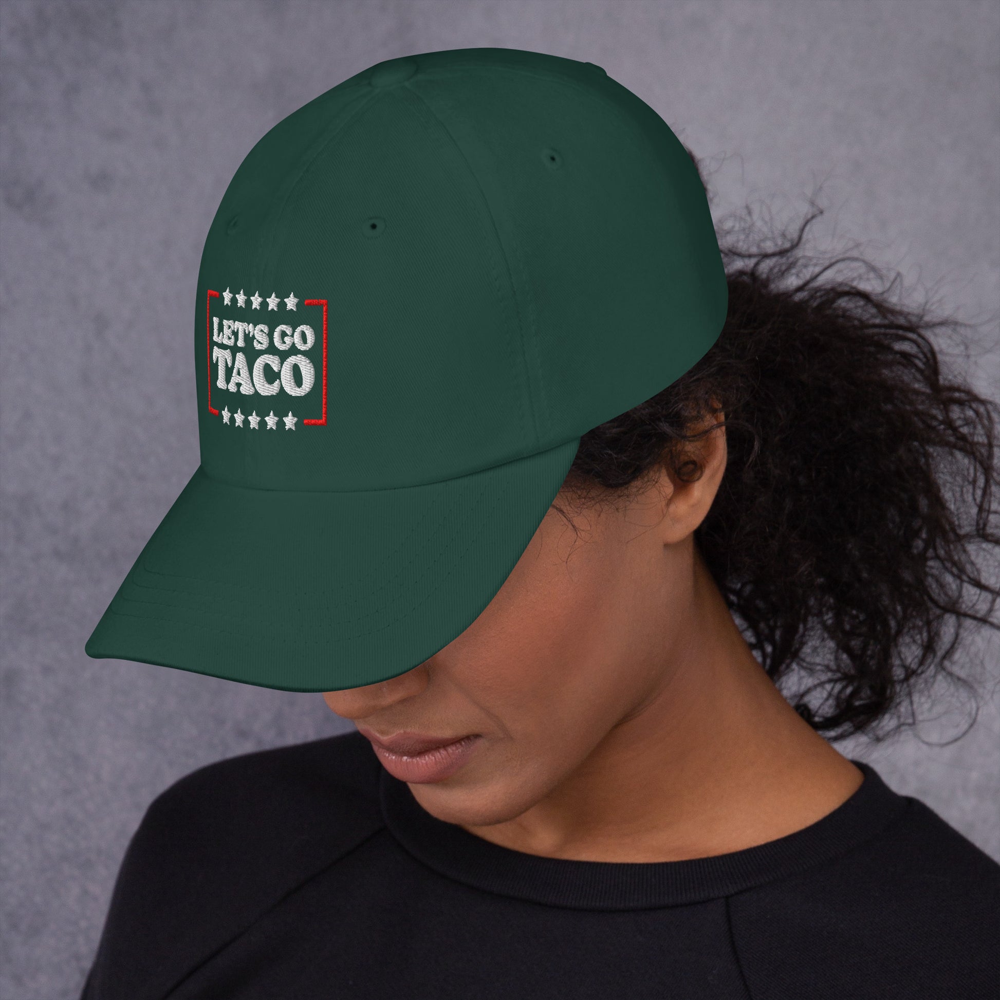 Lifestyle Image: Woman wearing Let’s Go T.A.C.O. Anti-Trump Dad Hat