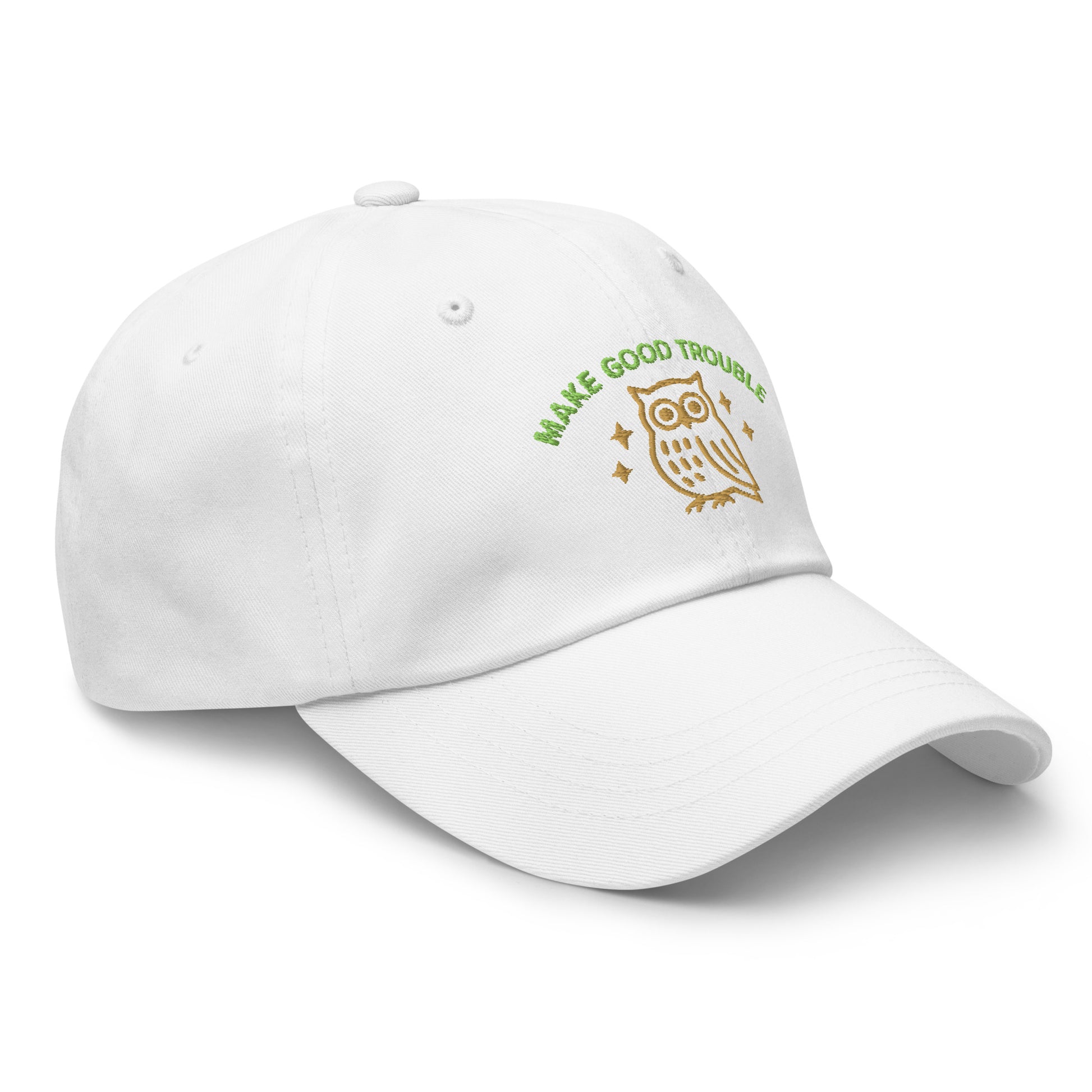 Side Front view of embroidered dad hat with “Make Good Trouble” text and golden owl - White