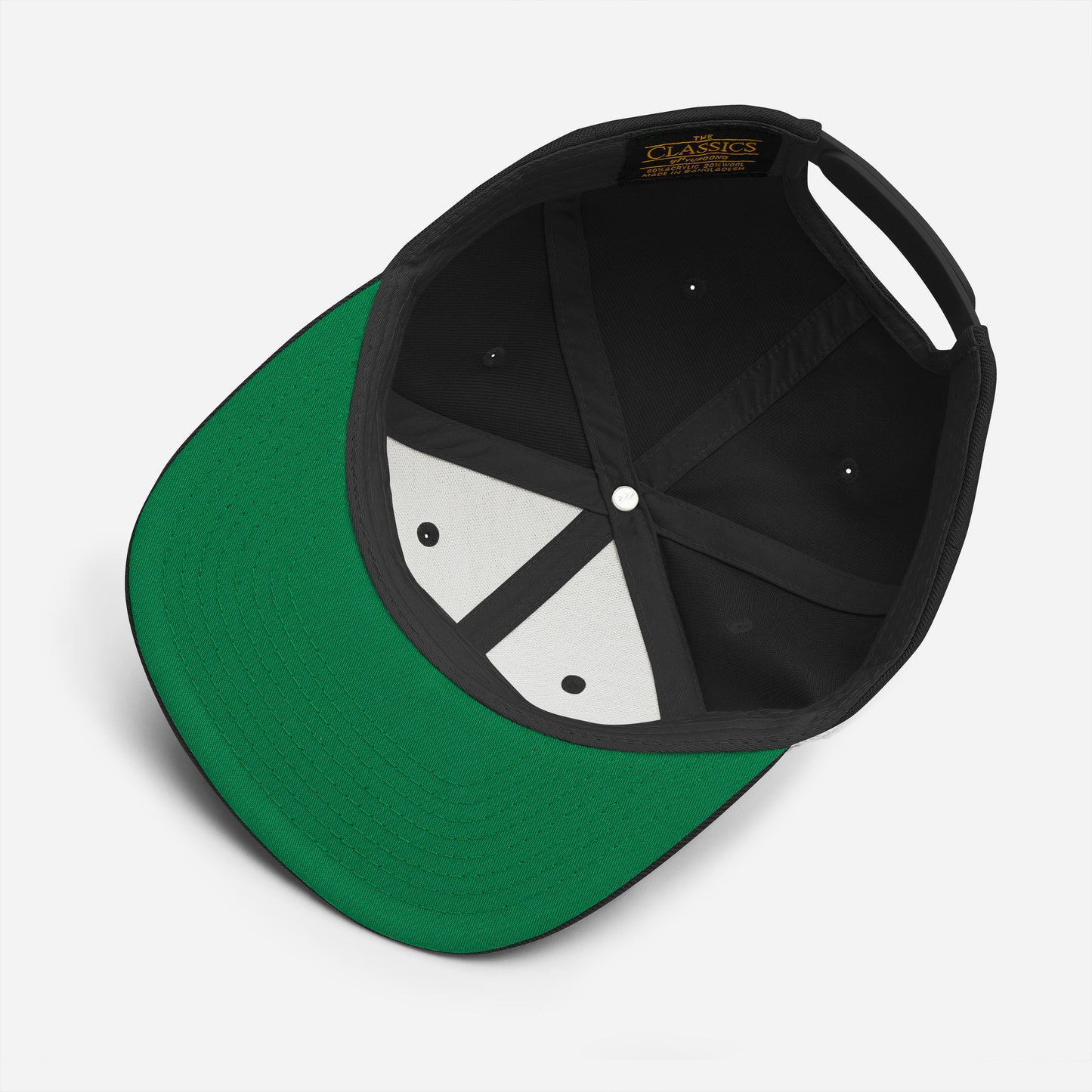 Top-down view of a black snapback hat revealing green underbill and interior stitching, featuring embroidered “BLM” lettering on the front panel.