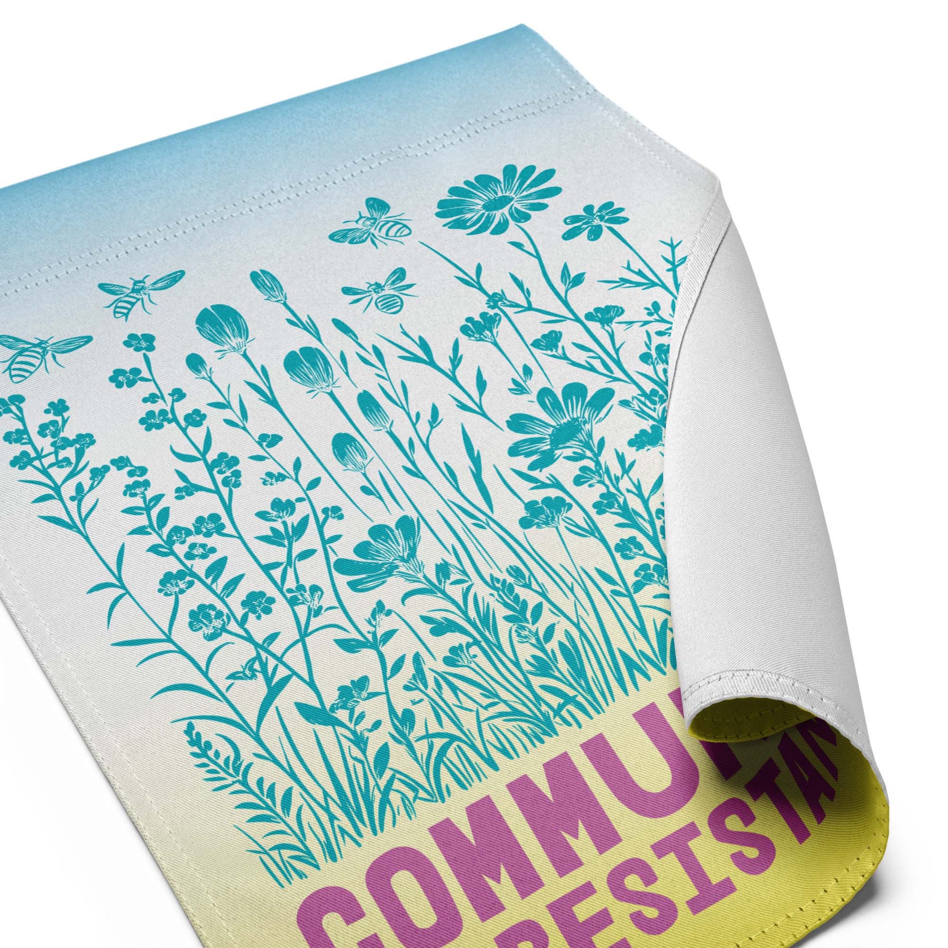 Zoomed view of the illustrated wildflowers and butterflies, with visible texture and color blending. A gentle, living metaphor for how communities flourish when they resist together.