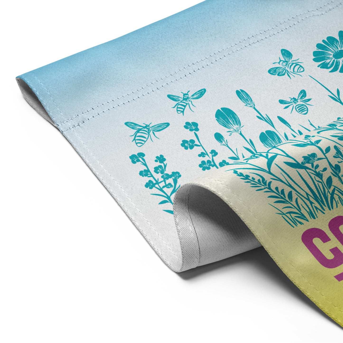 Close-up of the Community Is Resistance flag edge, showing sturdy stitching and vibrant fade from sky blue to butter yellow. Ethically printed fabric from Blue Wave USA reflects both quality and purpose.