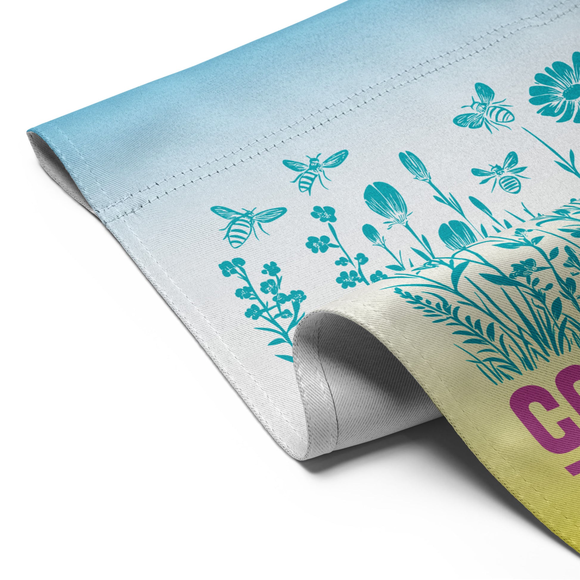 Close-up of the Community Is Resistance flag edge, showing sturdy stitching and vibrant fade from sky blue to butter yellow. Ethically printed fabric from Blue Wave USA reflects both quality and purpose.