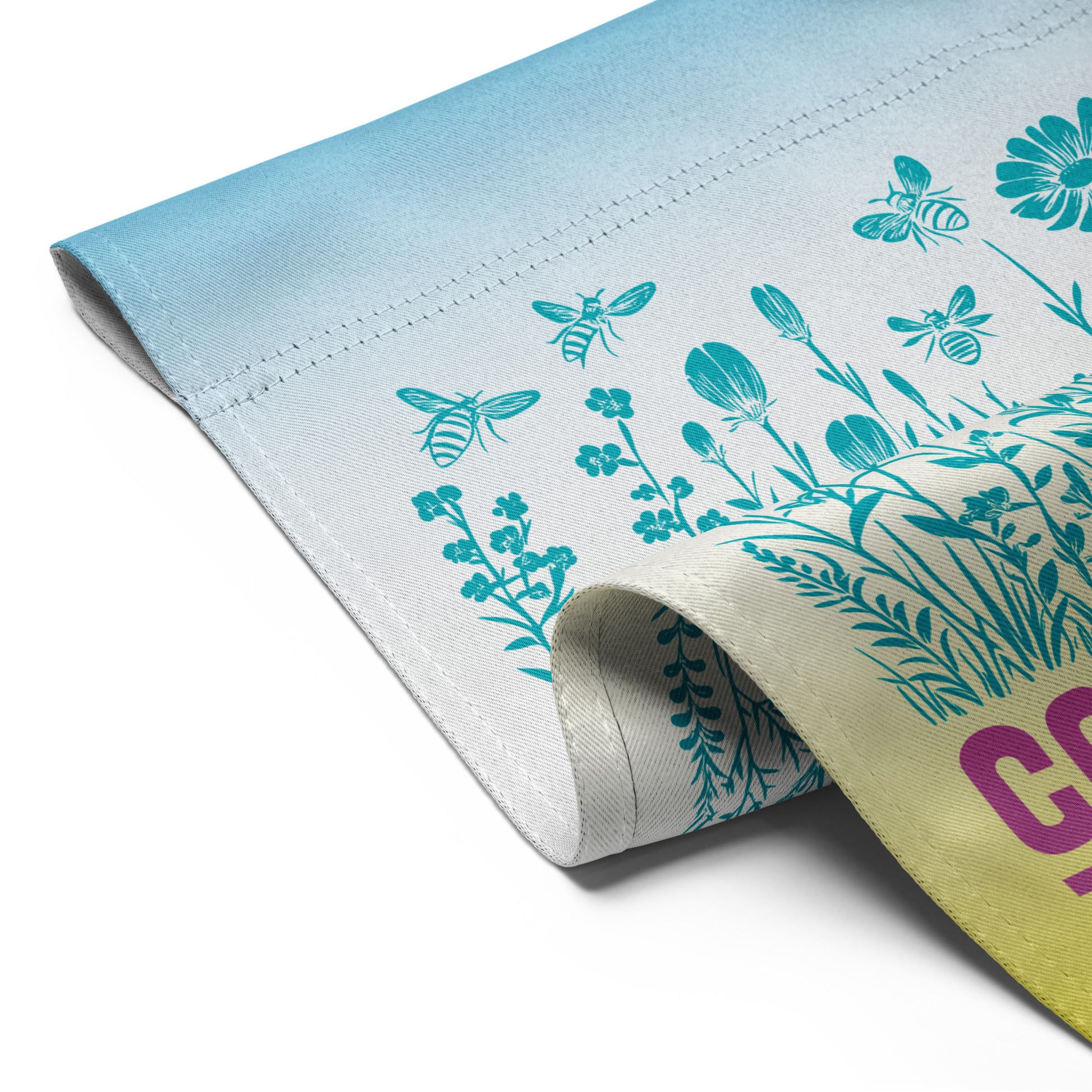 Close-up of the Community Is Resistance flag edge, showing sturdy stitching and vibrant fade from sky blue to butter yellow. Ethically printed fabric from Blue Wave USA reflects both quality and purpose.