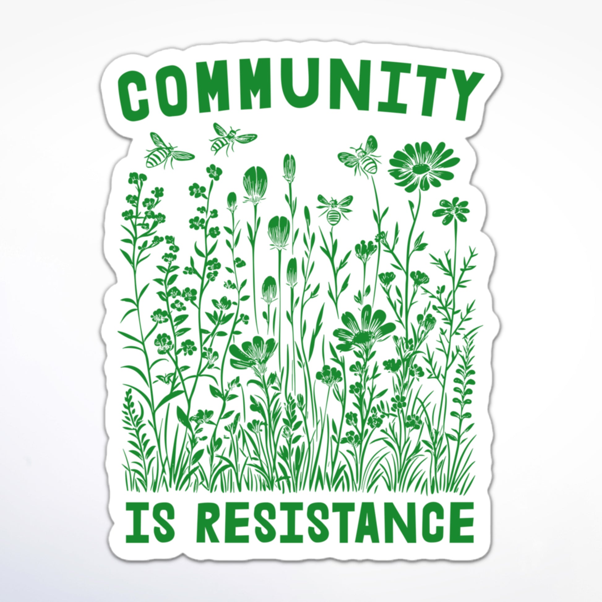 Social justice sticker with green wildflowers and bees, featuring the words “Community Is Resistance.”
