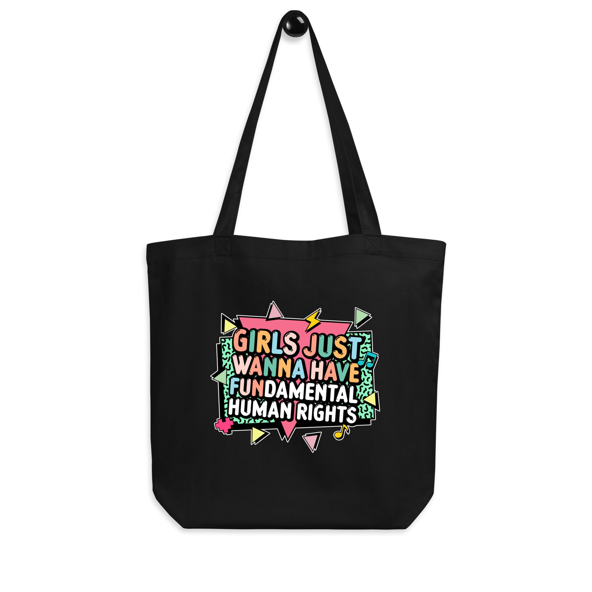 Hanging black tote with retro geometric design and the phrase “Girls Just Wanna Have Fundamental Human Rights.” Perfect for activists and advocates for women’s rights.