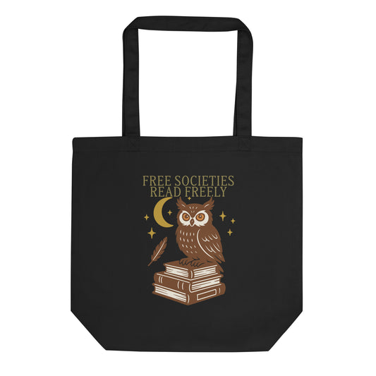 Black tote bag featuring a folk-art style owl perched on stacked books under a crescent moon with the text “Free Societies Read Freely.” Progressive book-ban awareness tote by Blue Wave USA.