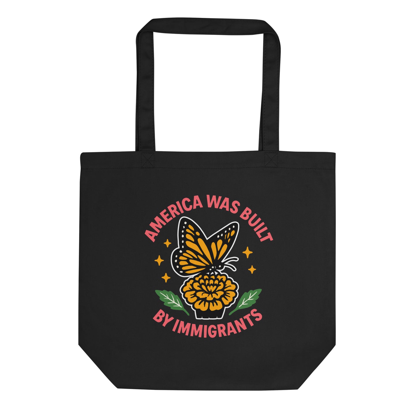 Black tote bag featuring a monarch butterfly perched on a marigold with the phrase “America Was Built by Immigrants.” Progressive eco tote by Blue Wave USA.